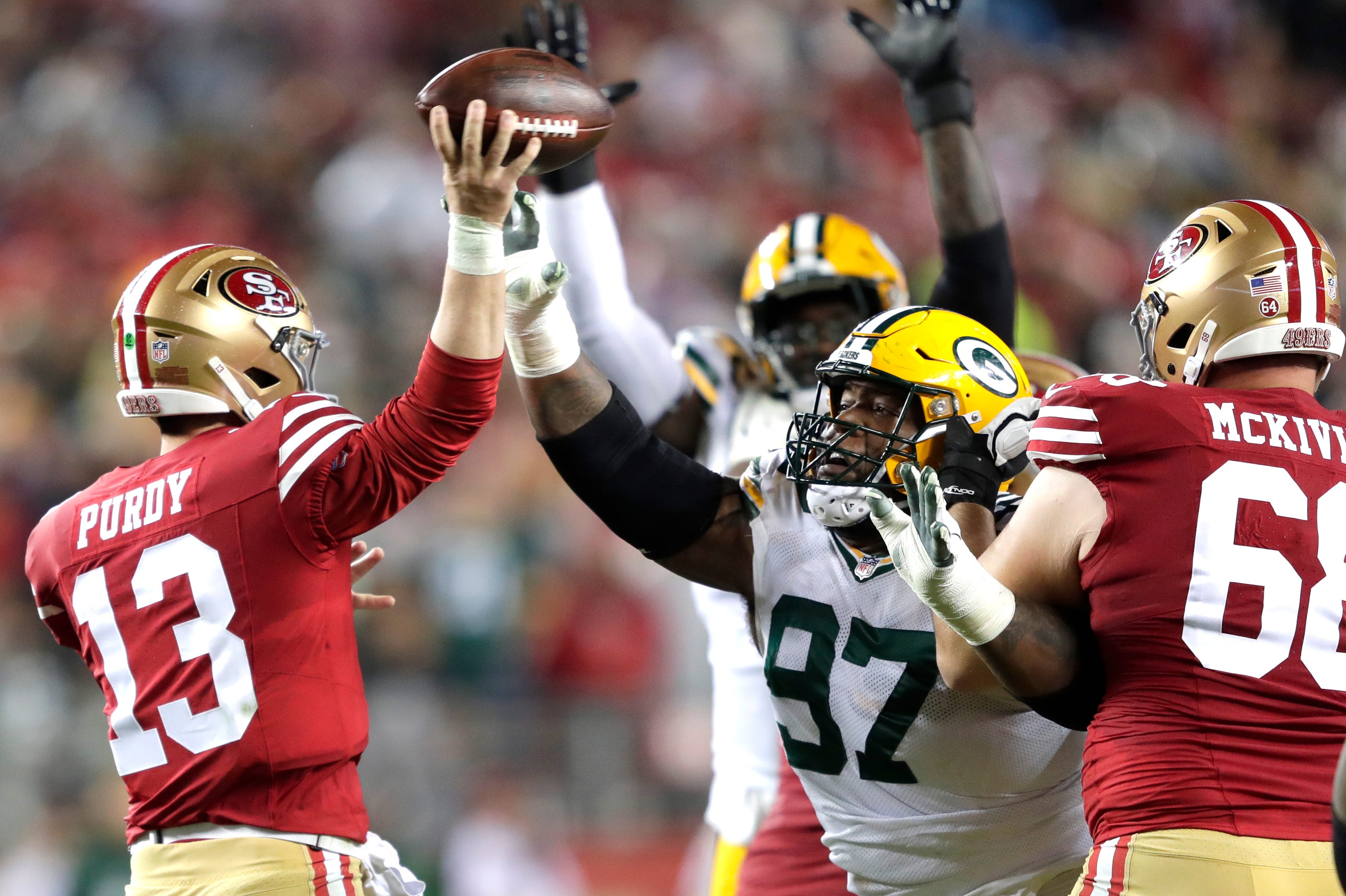 Green Bay Packers defensive tackle Kenny Clark (97) pressures San Francisco 49ers quarterback Brock Purdy (13) in the third quarter during their NFC divisional playoff football game Saturday, January 20, 2024, at Levi's Stadium in Santa Clara, California.