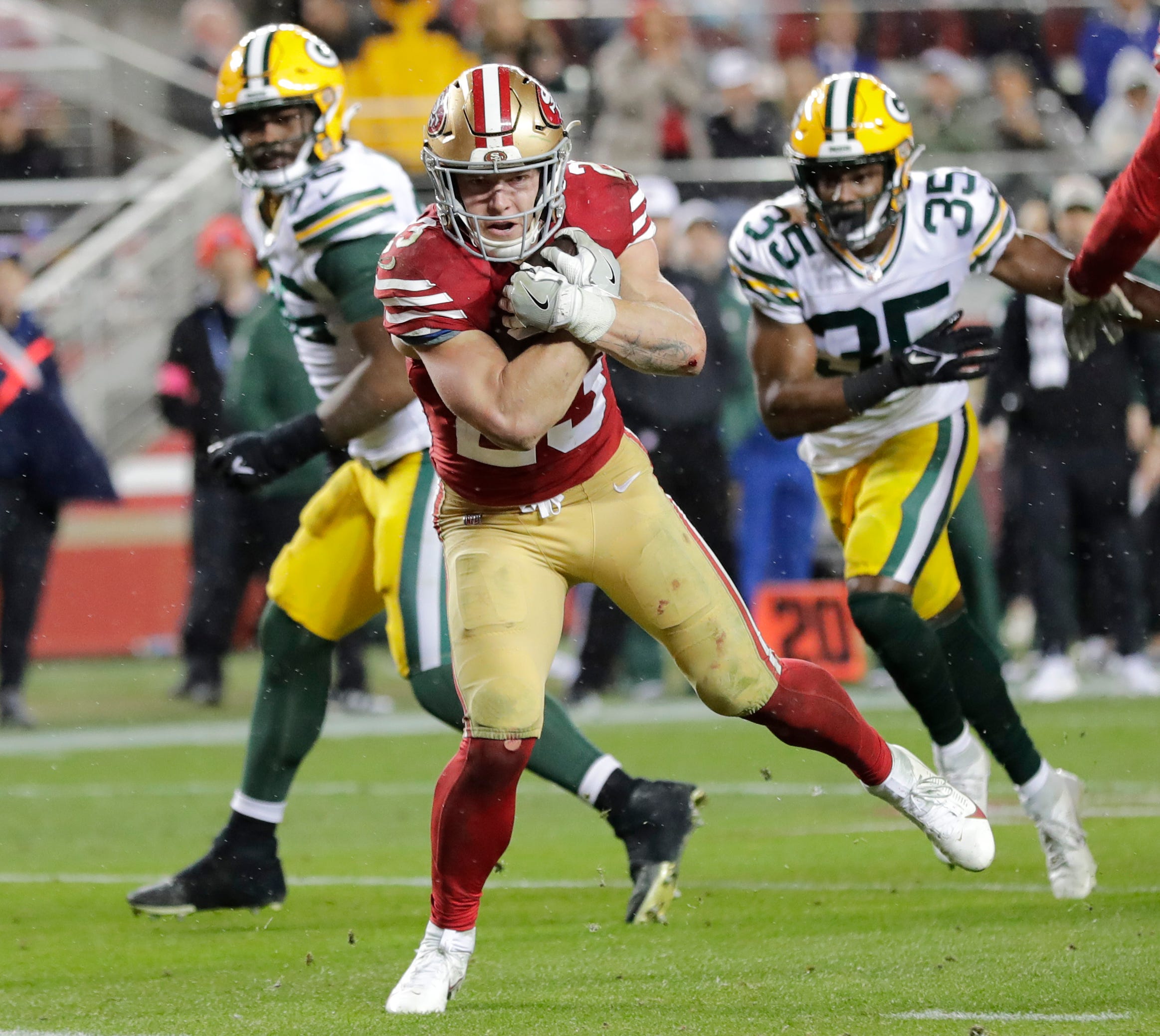 San Francisco 49ers running back Christian McCaffrey (23) crosses the goal line for the decisive touchdown late in the fourth quarter against the Green Bay Packers during their NFC divisional playoff football game Saturday, January 20, 2024, at Levi's Stadium in Santa Clara, California.