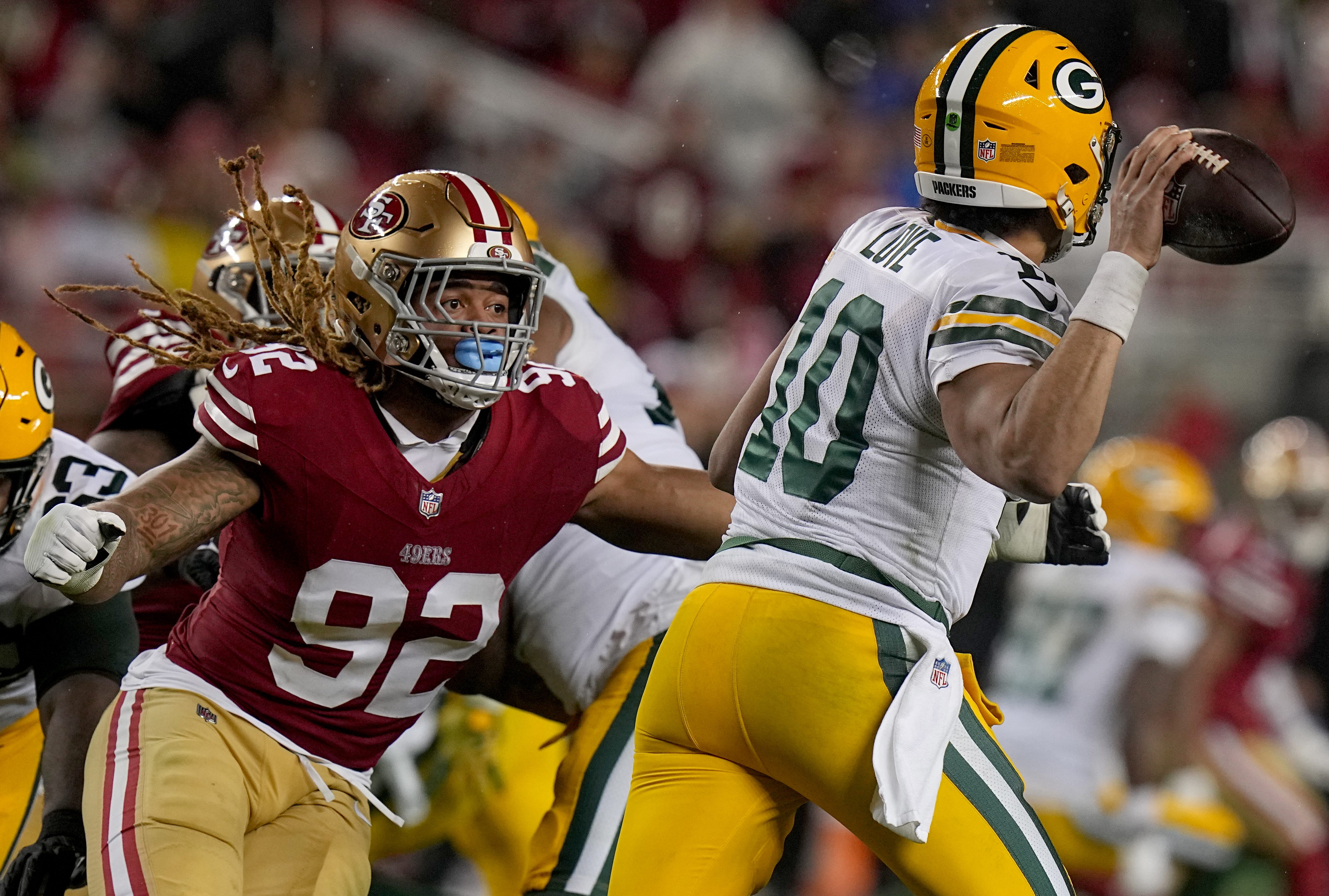 San Francisco 49ers defensive end Chase Young (92) pressures Green Bay Packers quarterback Jordan Love (10) during the third quarter of their NFC divisional playoff game Saturday, January 20, 2024 at Levi’ Stadium in Santa Clara, California. The San Francisco 49ers beat the Green Bay Packers 24-21.