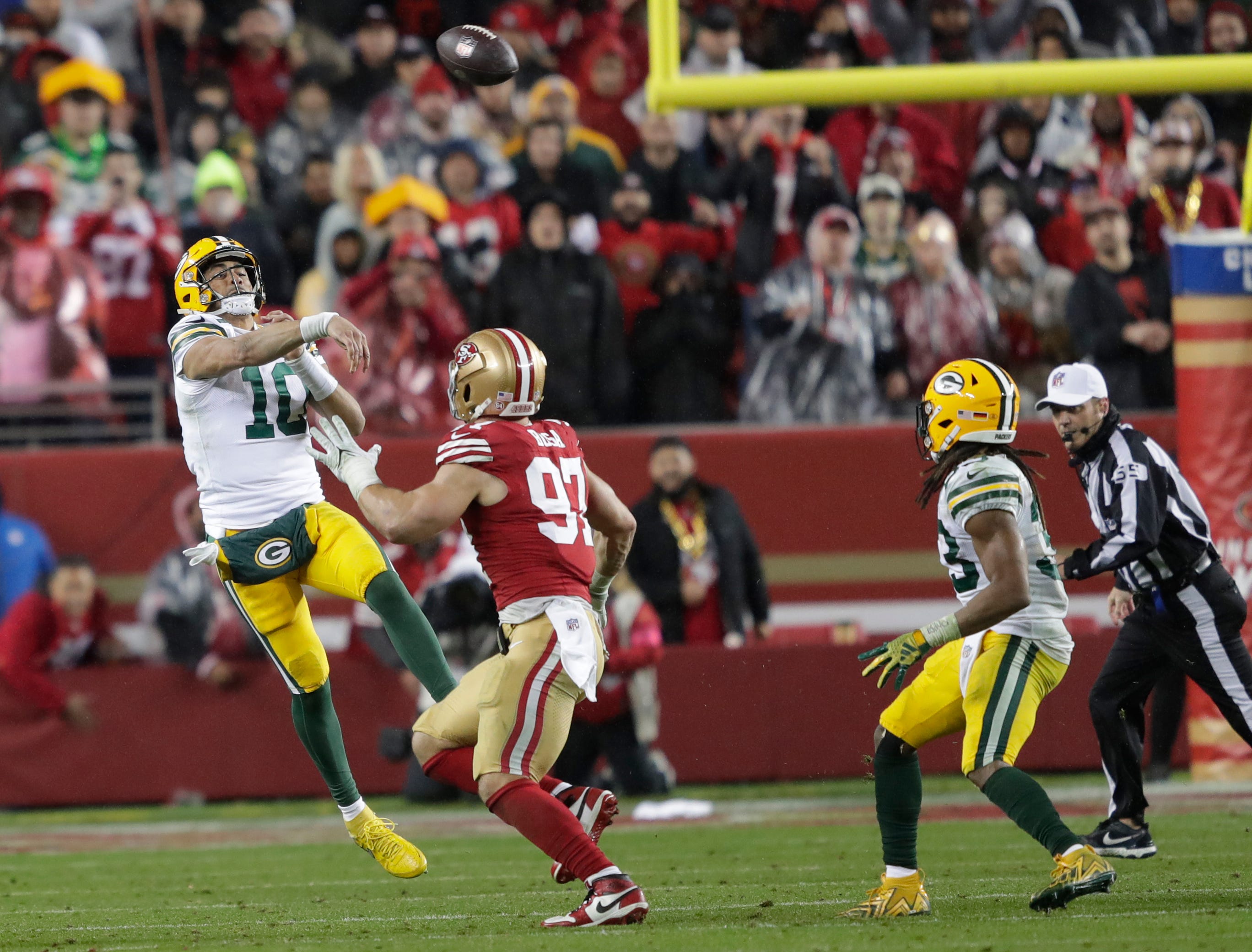 Green Bay Packers quarterback Jordan Love (10) throws an interception that is caught by San Francisco 49ers linebacker Dre Greenlaw (not pictured) late in the fourth quarter during their NFC divisional playoff football game Saturday, January 20, 2024, at Levi's Stadium in Santa Clara, California.
