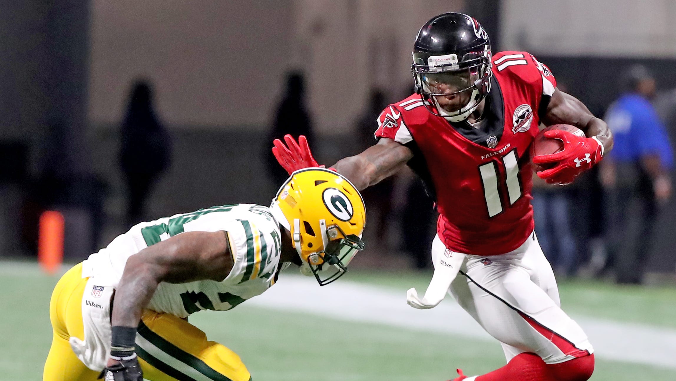 Packers cornerback Quinten Rollins gives up a catch to wide receiver Julio Jones (11) during a September 2017 game against the Falcons at Mercedes-Benz Stadium in Atlanta.