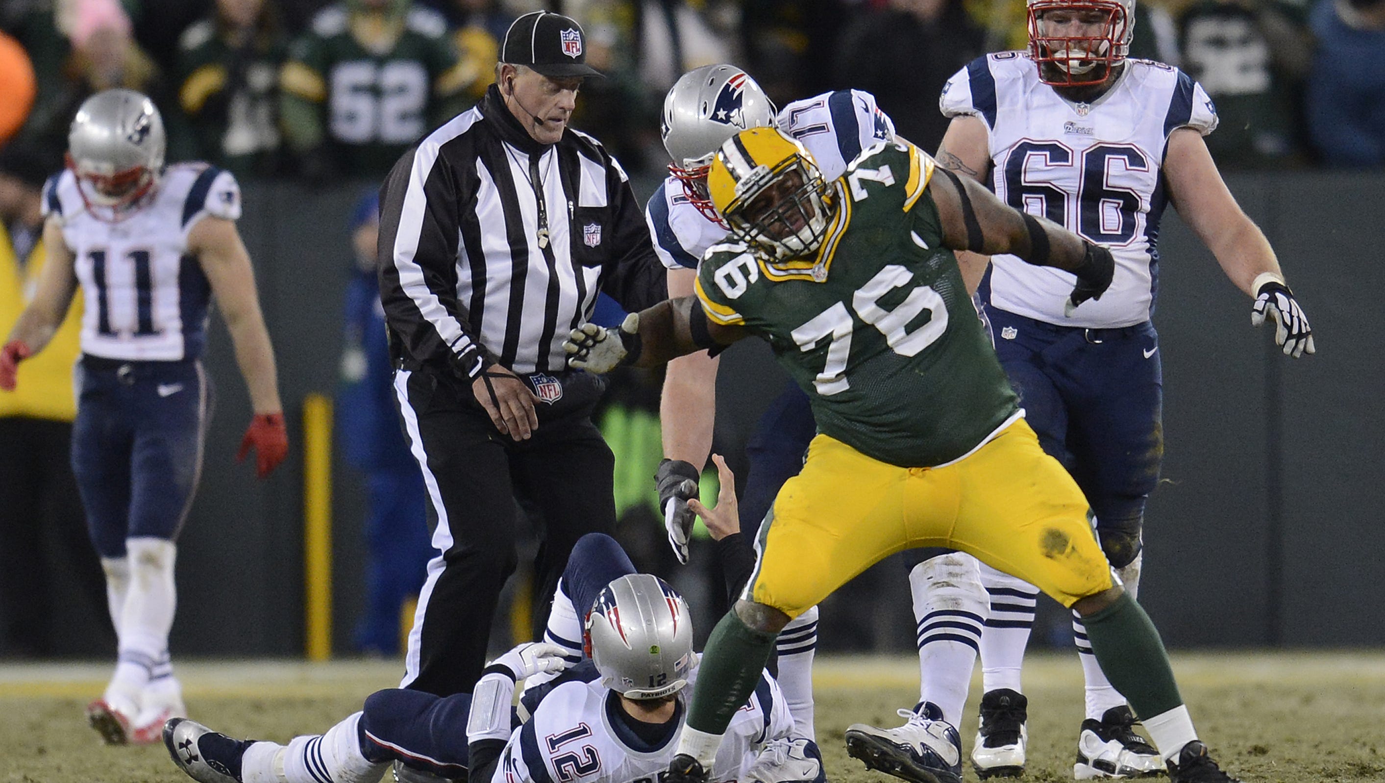 Green Bay Packers defensive tackle Mike Daniels (76) celebrates after sacking New England Patriots quarterback Tom Brady (12) late in the fourth quarter on Nov. 30, 2014, at Lambeau Field.