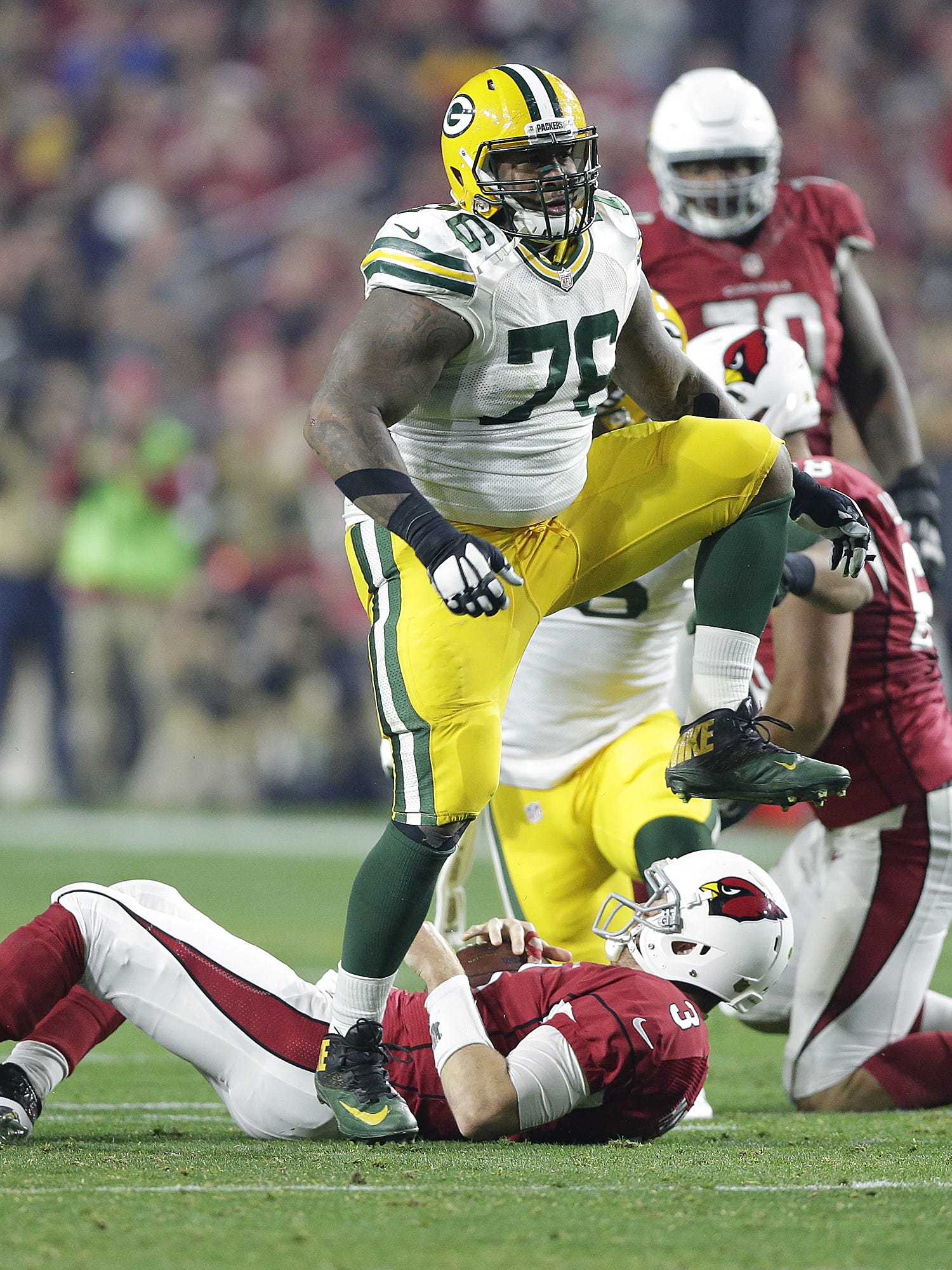 Green Bay Packers defensive tackle Mike Daniels (76) reacts after sacking Arizona Cardinals quarterback Carson Palmer (3) in the second quarter of an NFC divisional playoff game on Jan. 16, 2016, at University of Phoenix Stadium in Glendale, Ariz.