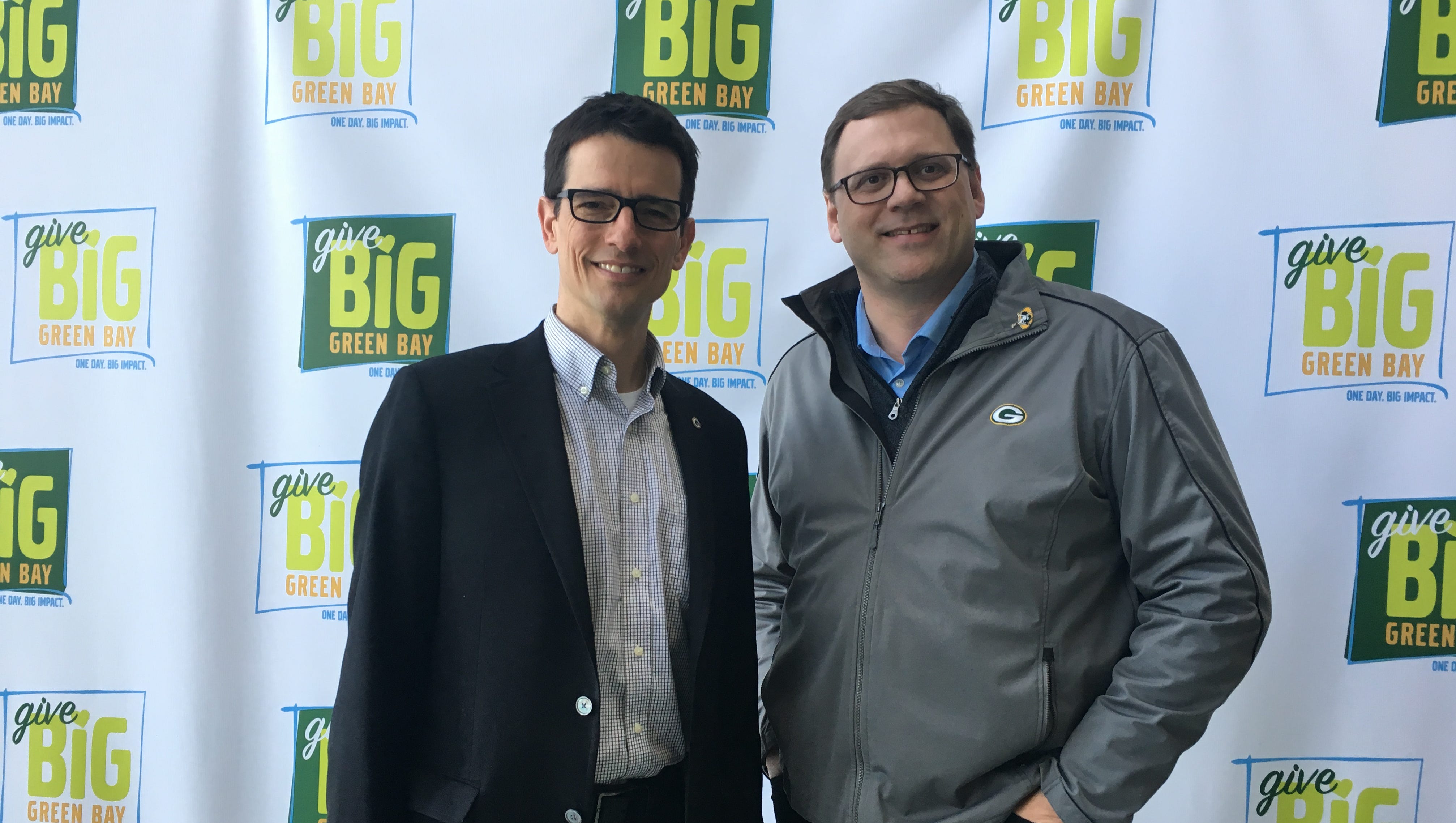 Green Bay Packers Director of Public Affairs Aaron Popkey, left, and Dennis Buehler, president of the Greater Green Bay Community Foundation at the end of the 24-hour Give Big Green Bay fundraiser.