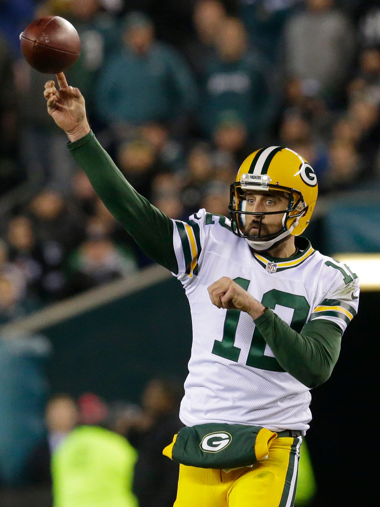 Aaron Rodgers throws a pass.