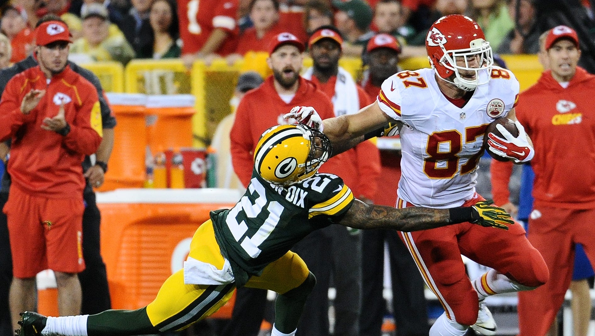 Kansas City Chiefs tight end Travis Kelce (87) stiff arms Green Bay Packers free safety Ha Ha Clinton-Dix (21) in the second quarter. The Green Bay Packers hosted the Kansas City Chiefs at Lambeau Field in Green Bay, Wis. on Monday, Sept. 28, 2015.