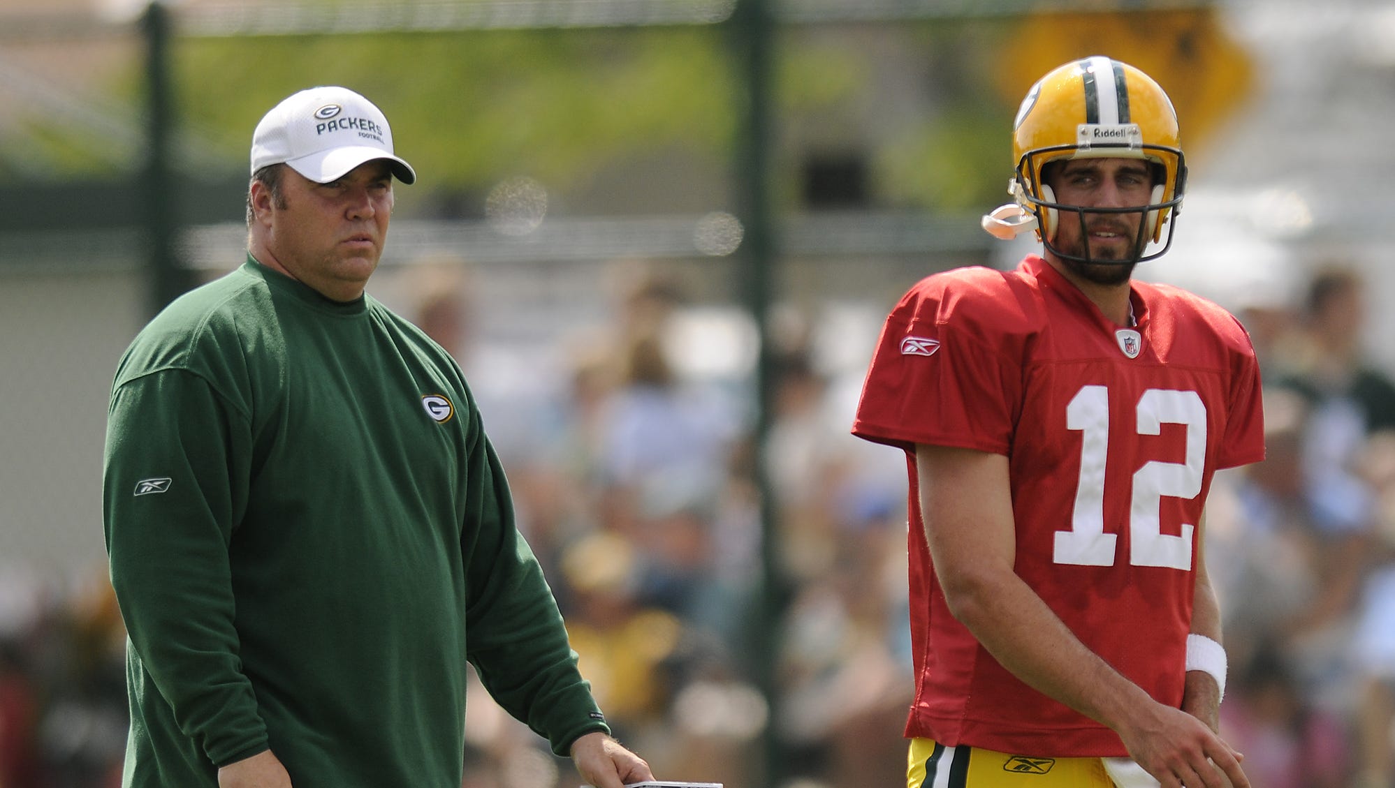 Green Bay Packers coach Mike McCarthy and quarterback Aaron Rodgers (12) during training camp practice on Aug. 5, 2008, at Clarke Hinkle Field.