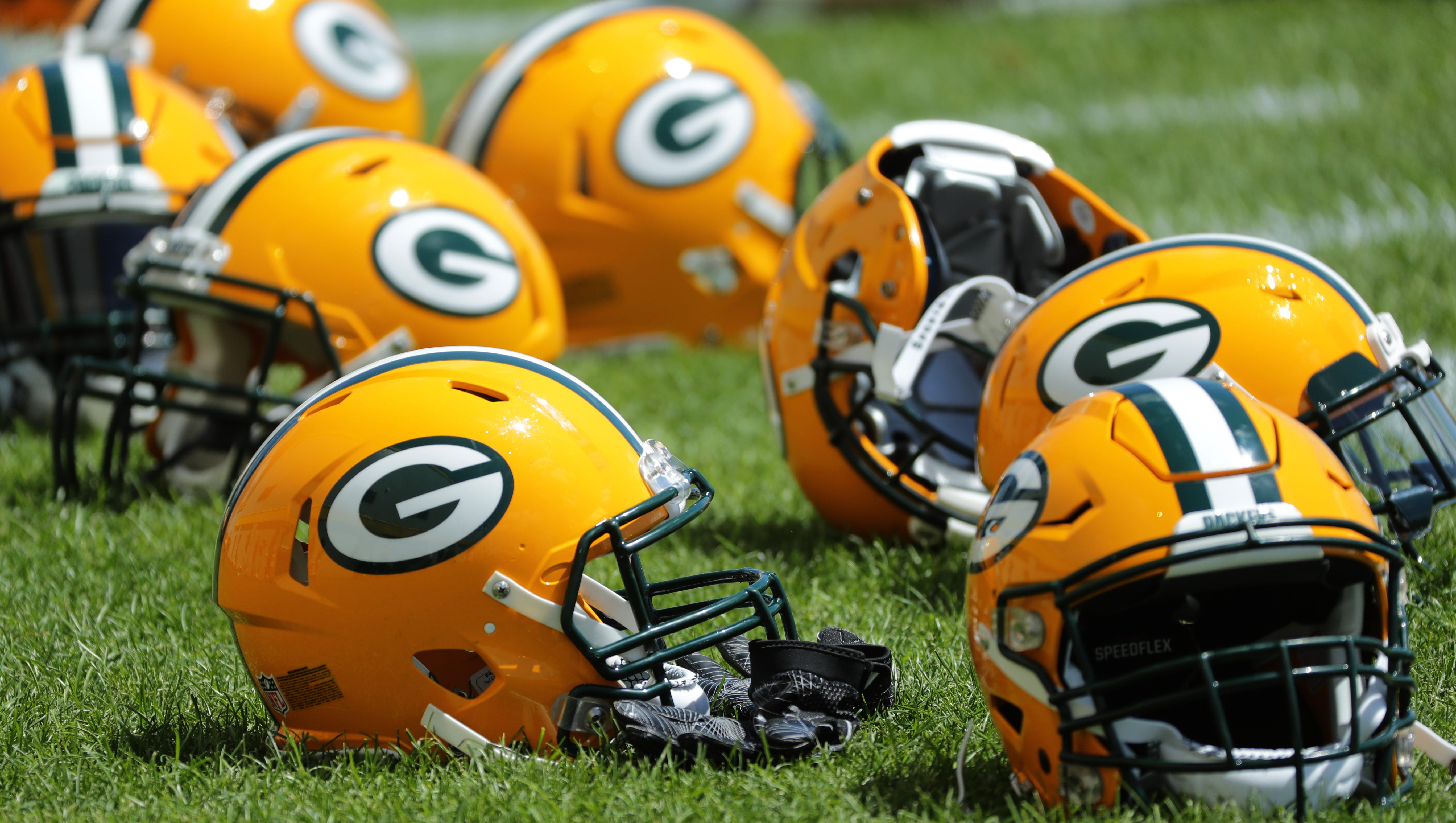 Green Bay Packers helmets are shown during organized team activities Monday, June 4, 2018 in Green Bay, Wis.
