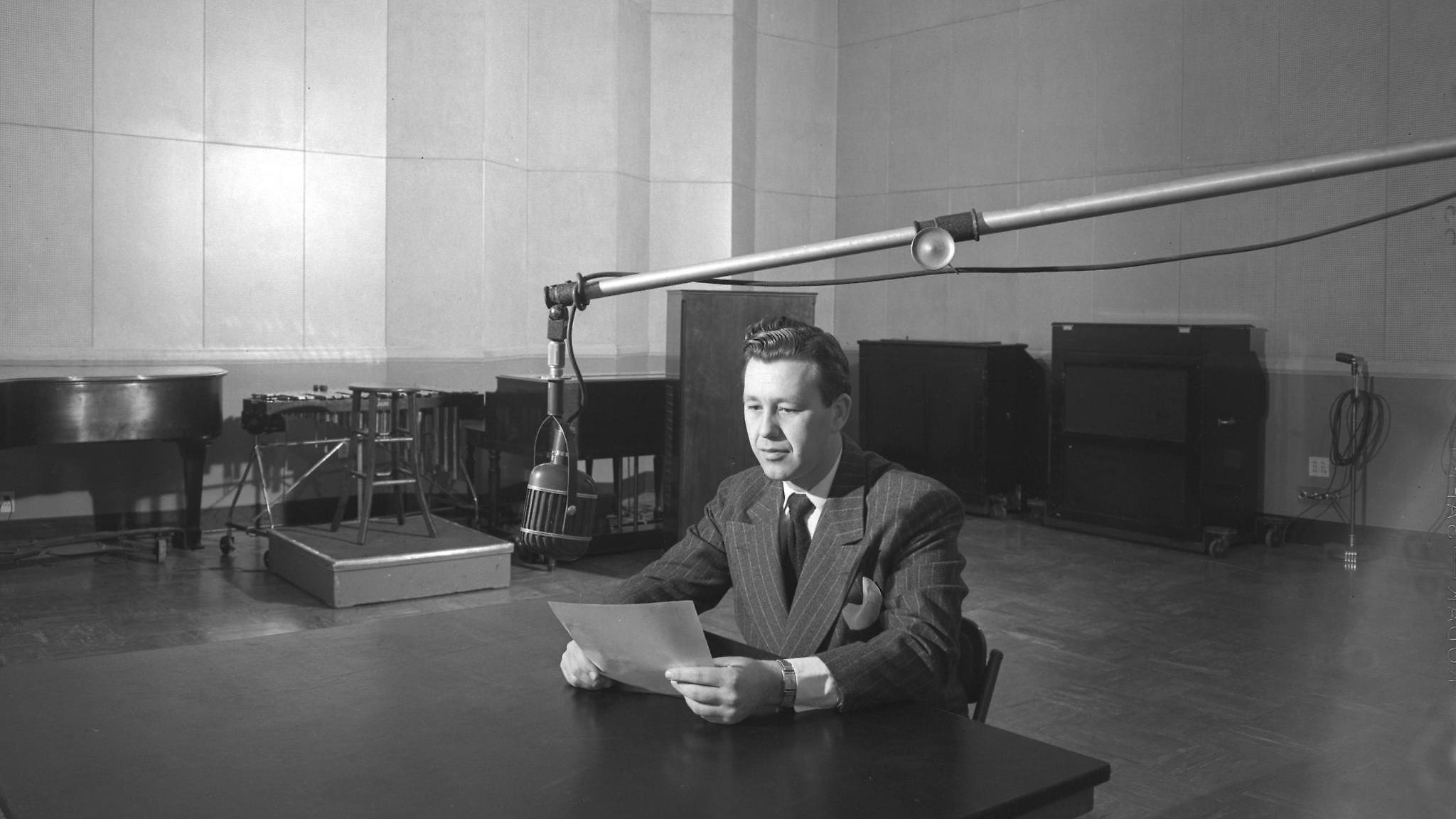 An announcer on WTMJ radio takes to the air at the station’s studio at Radio City on E. Capitol Drive in this photo, likely from 1946.