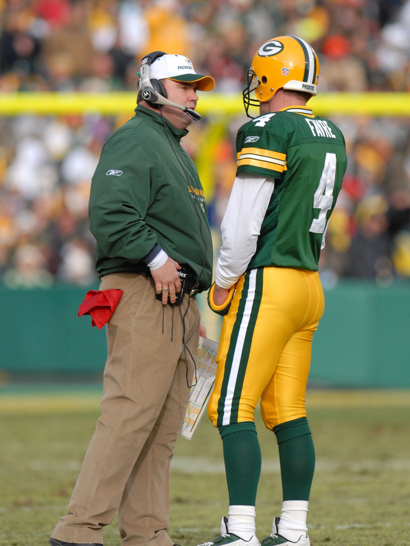 Packers coach Mike McCarthy talks with Brett Favre during a timeout against the Detroit Lions on Dec. 17, 2006, at  Lambeau Field.