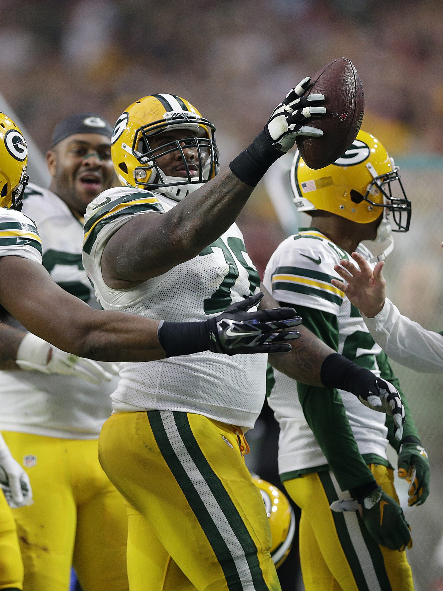 Green Bay Packers defensive tackle Mike Daniels (76) reacts after making an interception against the Arizona Cardinals on Dec. 27, 2015, at University of Phoenix Stadium in Glendale, Ariz.