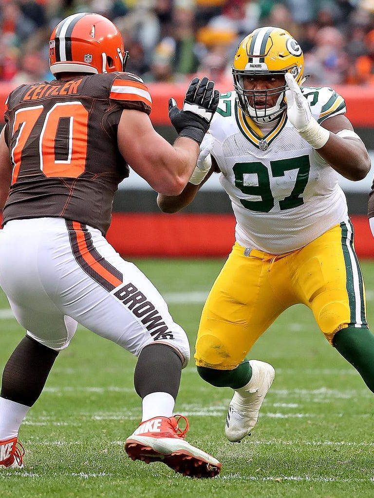 Green Bay Packers nose tackle Kenny Clark (97) rushes on Cleveland Browns offensive guard Kevin Zeitler (70) on Dec. 10, 2017 at FirstEnergy Stadium in Cleveland.