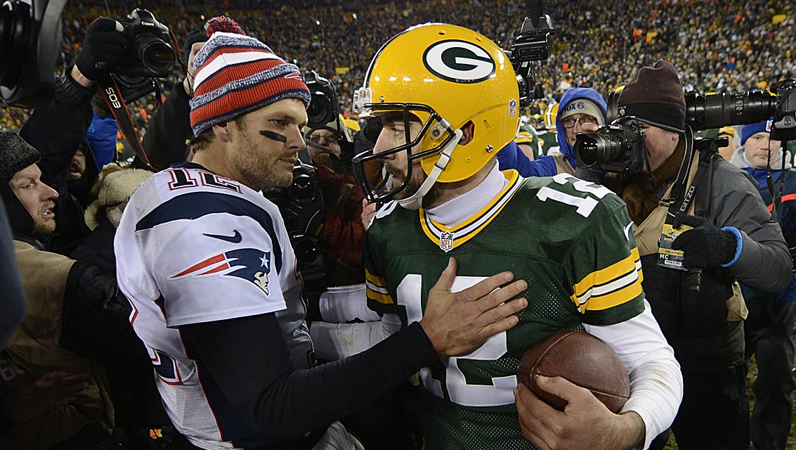 Green Bay Packers quarterback Aaron Rodgers and New England Patriots quarterback Tom Brady exchange words after a Nov. 2014 at Lambeau Field.