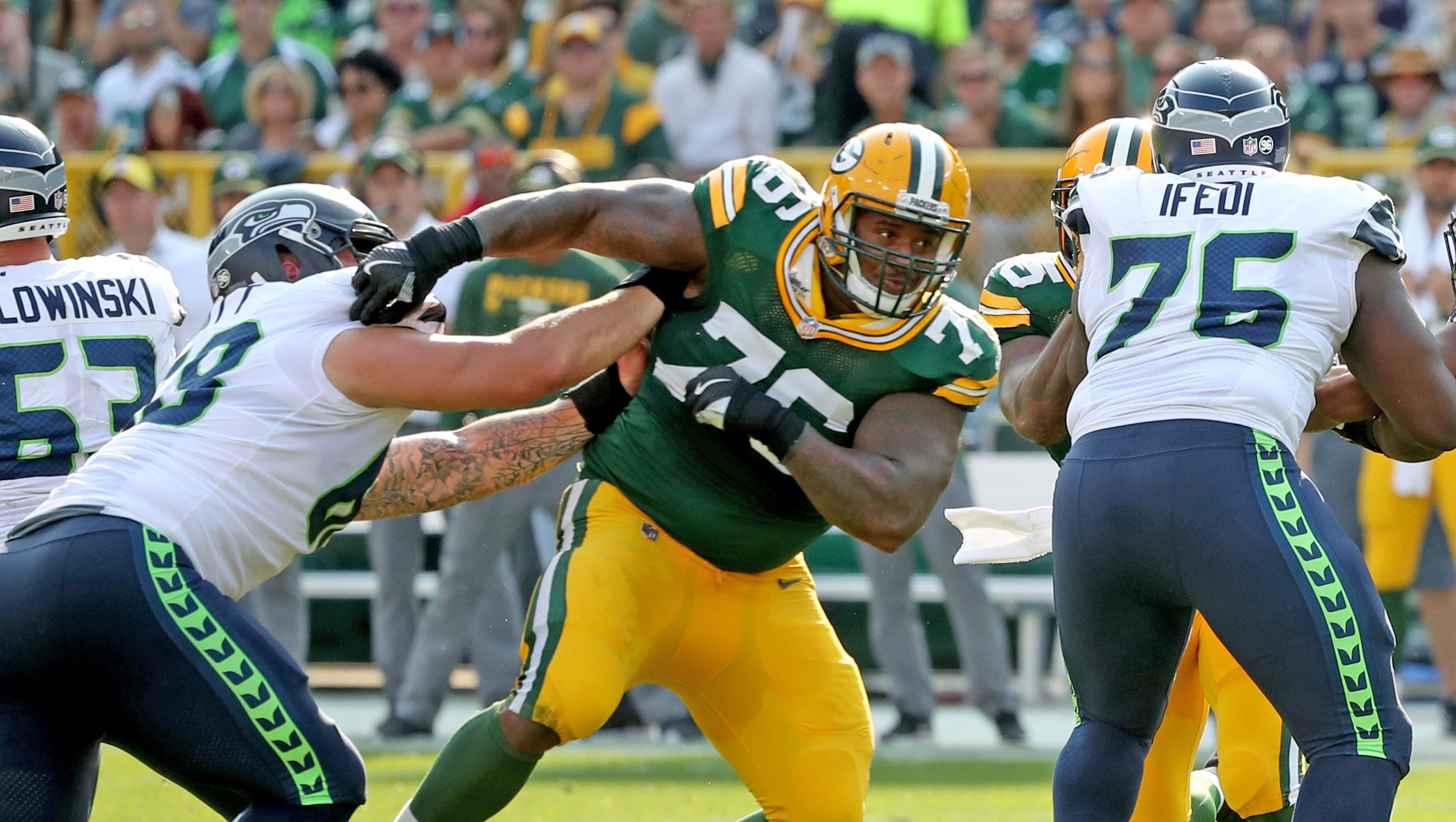Green Bay Packers defensive end Mike Daniels (76)  breaks through the line of scrimmage against the Seattle Seahawks on Sept. 10, 2017, at Lambeau Field in Green Bay.