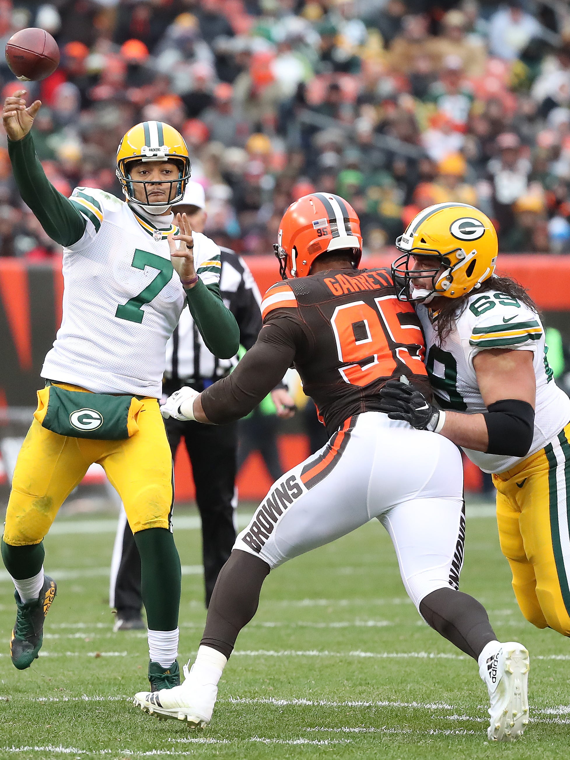 Green Bay Packers quarterback Brett Hundley (7) throws from the pocket as left tackle David Bakhtiari (69) blocks Cleveland Browns defensive end Myles Garrett (95) on Dec. 10, 2017, at FirstEnergy Stadium in Cleveland.
