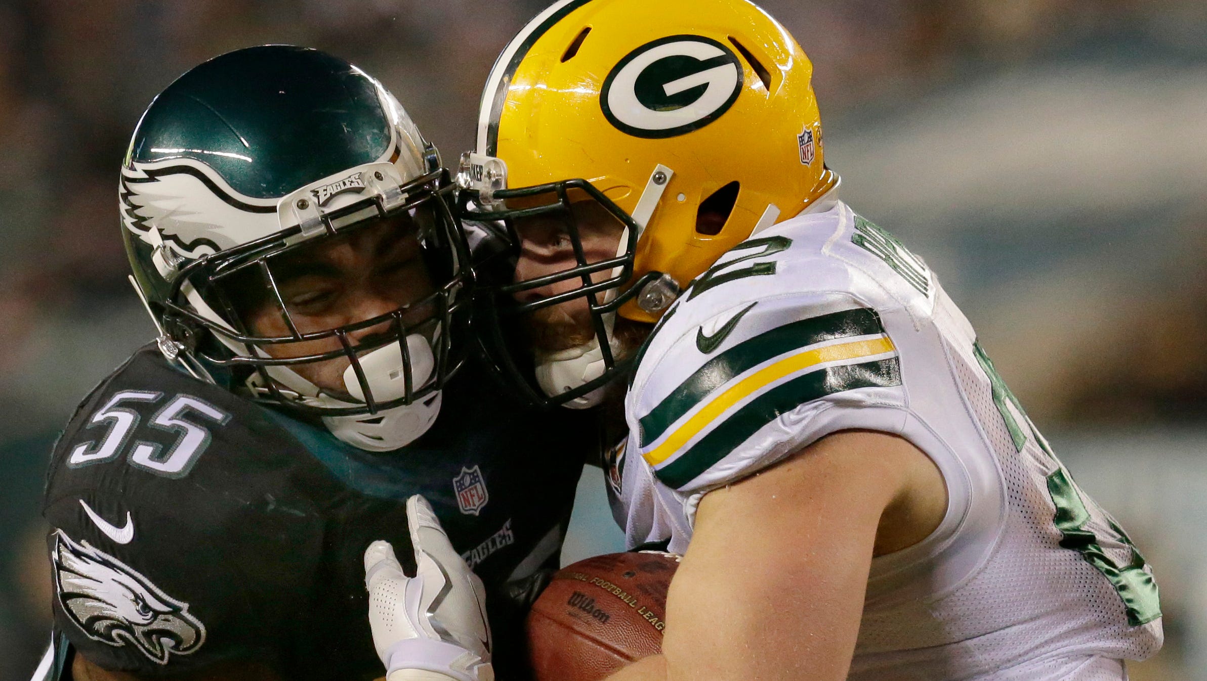 Fullback Aaron Ripkowski grinds out some yardage while being hit by Eagles defensive end Brandon Graham.