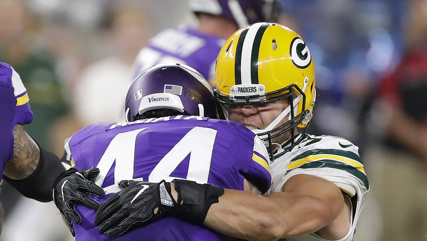 Green Bay Packers inside linebacker Blake Martinez tackles Minnesota Vikings running back Matt Asiata on Sept. 18, 2016, at U.S. Bank Stadium.