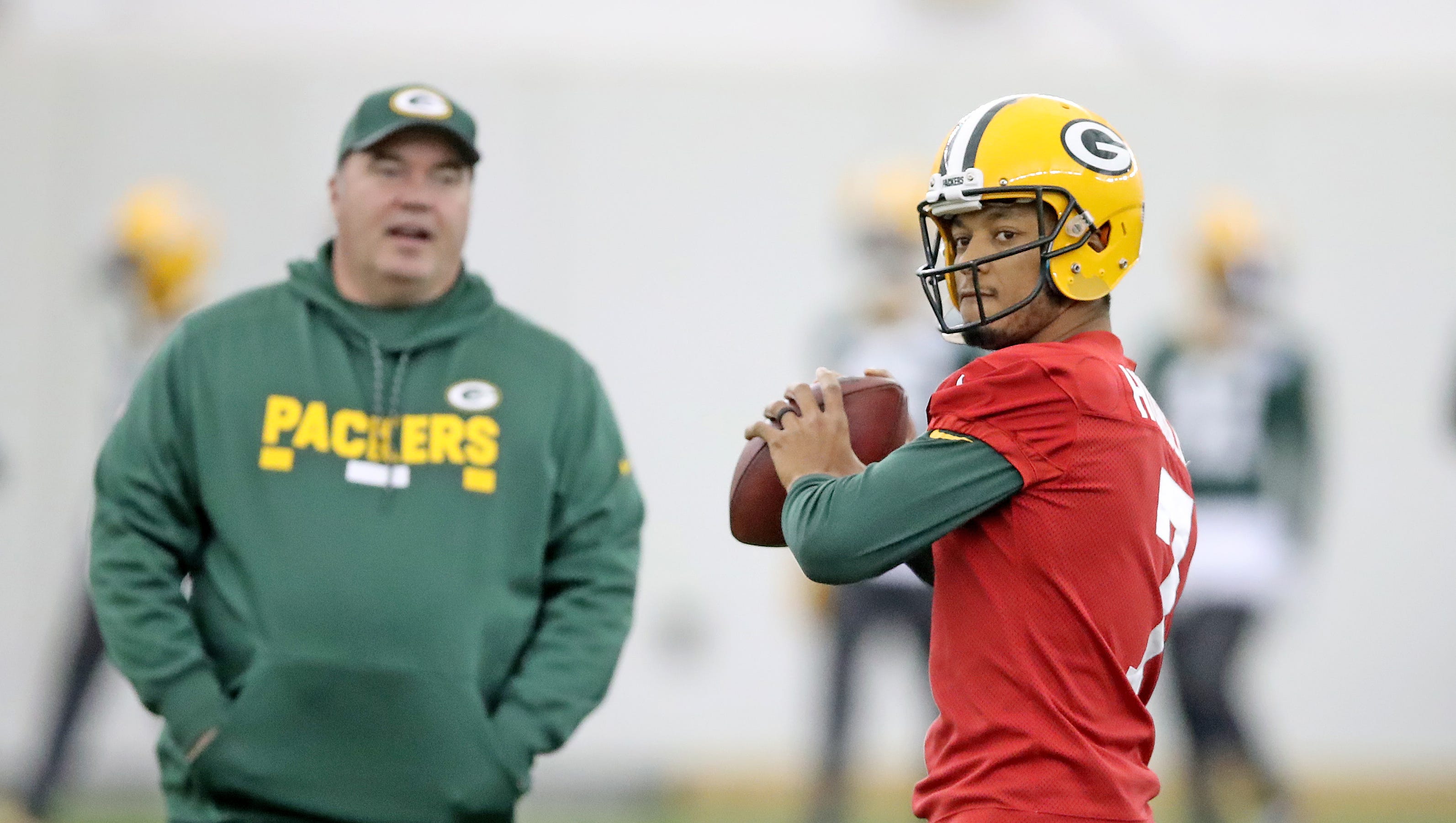 Green Bay Packers quarterback Brett Hundley (7) throws as coach Mike McCarthy looks on during practice on Oct. 31, 2017, in the Don Hutson Center.