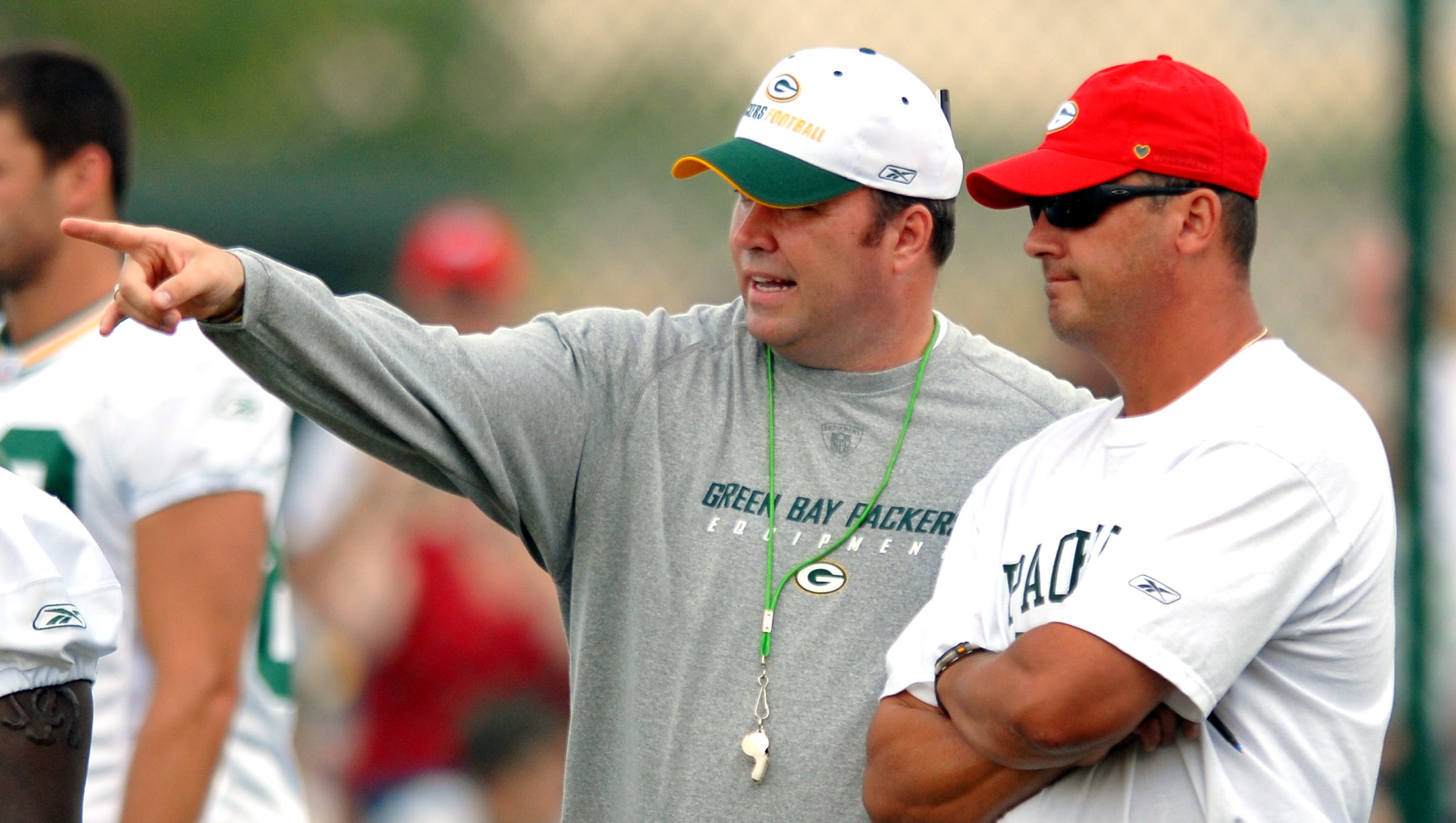 Green Bay Packers coach Mike McCarthy, left, makes a point with offensive coordinator Jeff Jagodzinski during training camp practice on Aug. 10, 2006, at Clarke Hinkle Field in Ashwaubenon.
