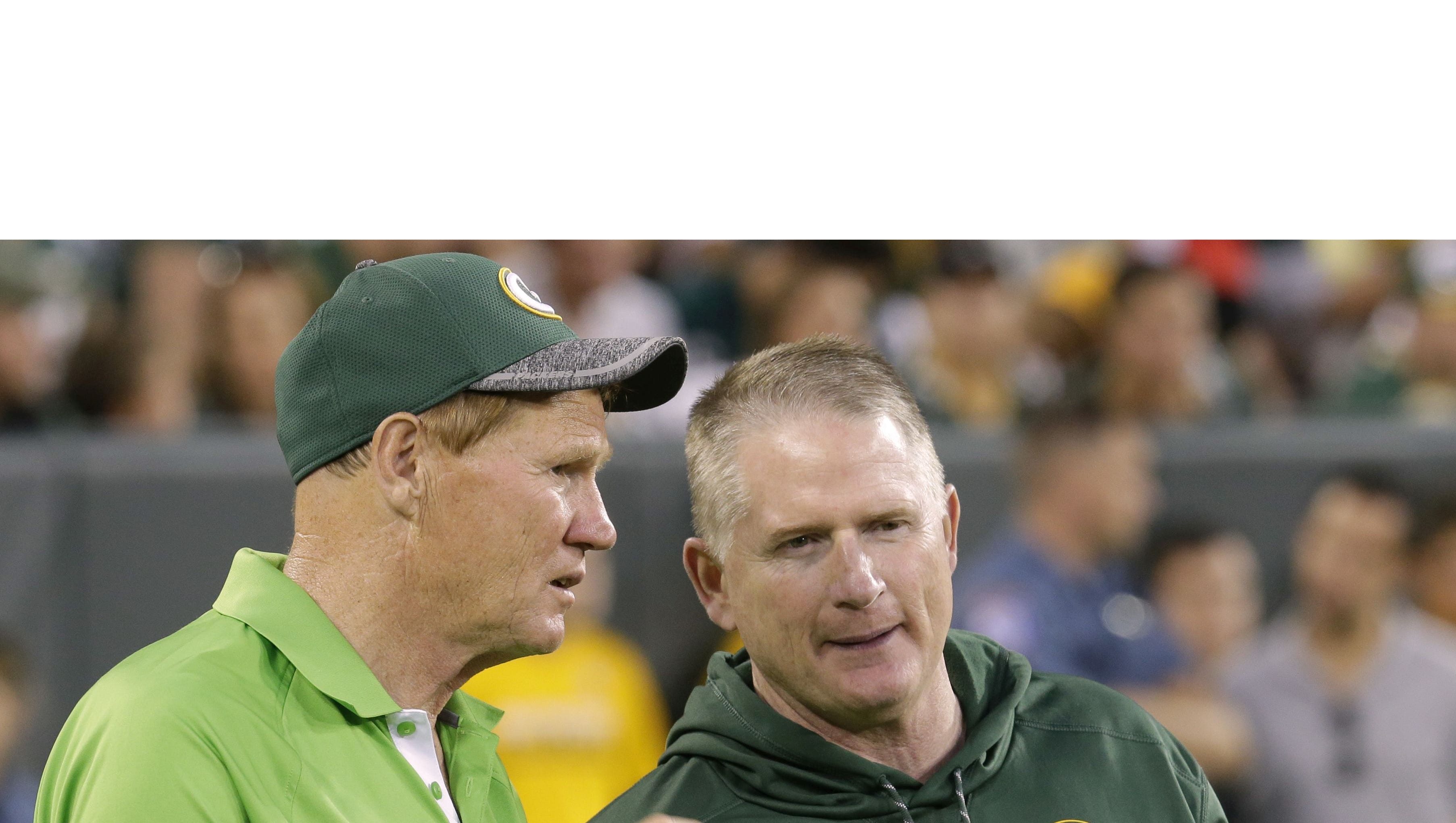 Green Bay Packers president Mark Murphy (left) talks with vice president of football administration/player finance Russ Ball during the team's 16th annual Family Night practice Sunday, July 31, 2016 at Lambeau Field in Green Bay.