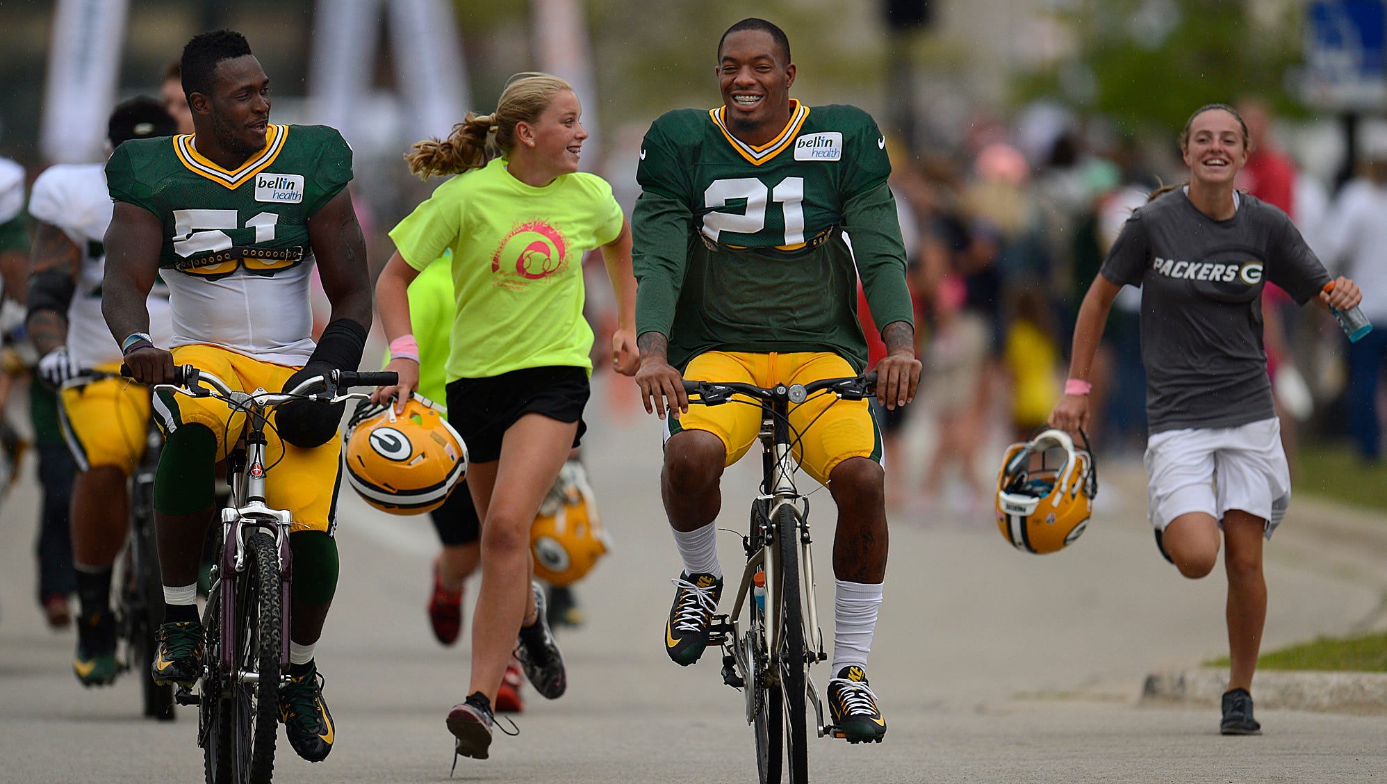 Packers safety Ha Ha Clinton-Dix rides a youngster's bike to training camp practice at Ray Nitschke Field on Aug. 7, 2015.