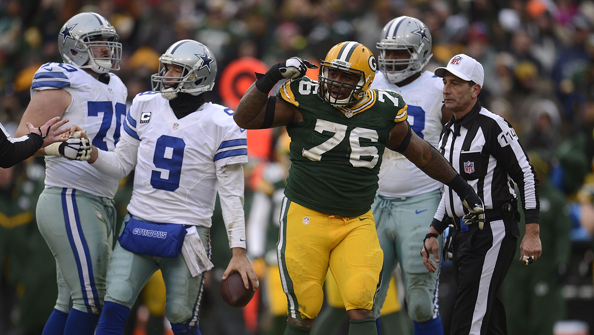 Green Bay Packers defensive tackle Mike Daniels celebrates after the Packers sacked Dallas Cowboys quarterback Tony Romo (9) during an NFC divisional playoff game at Lambeau Field.
