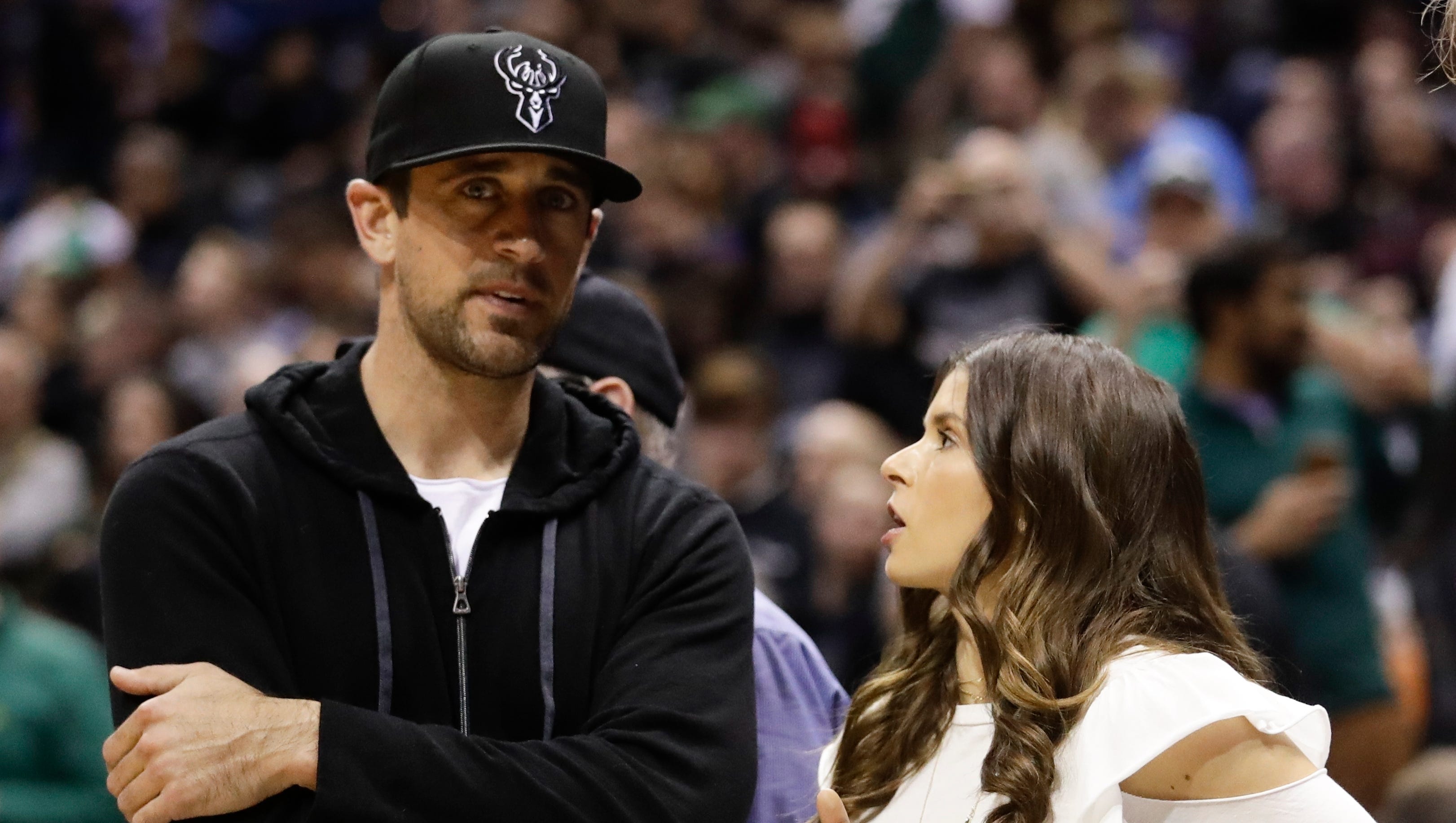Green Bay Packers QB Aaron Rodgers talks with Danica Patrick at Game 3 on Friday night in Milwaukee.