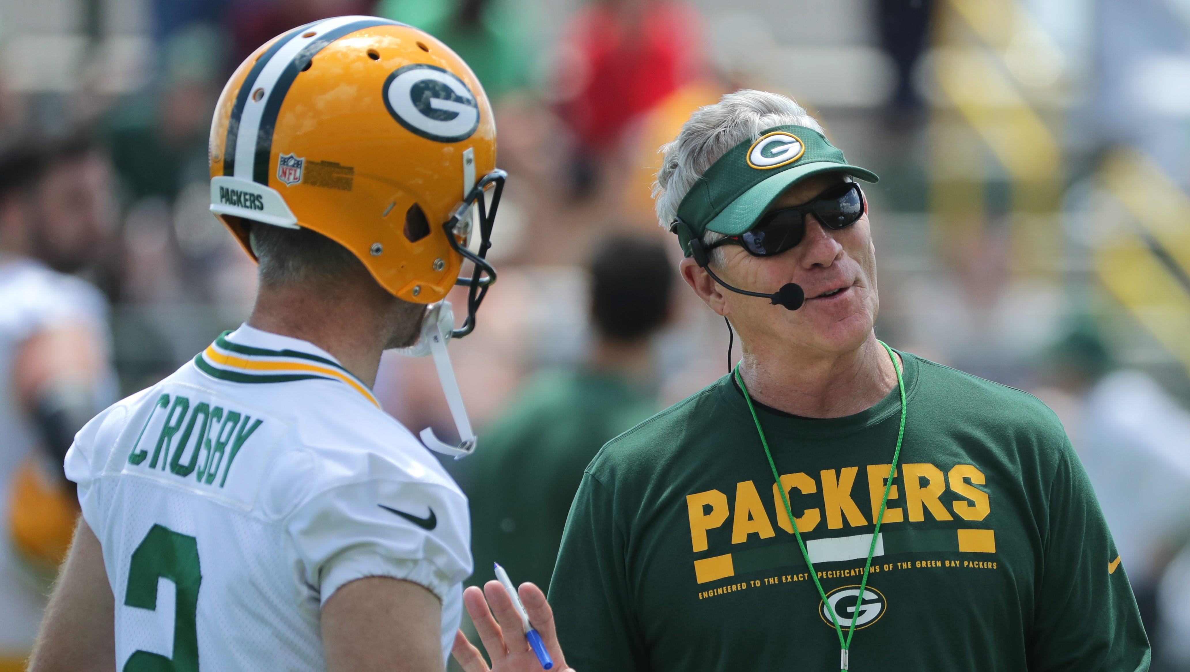 Green Bay Packers special teams coordinator Ron Zook talks with kicker Mason Crosby (2) during organized team activities Monday, June 4, 2018 in Green Bay, Wis.