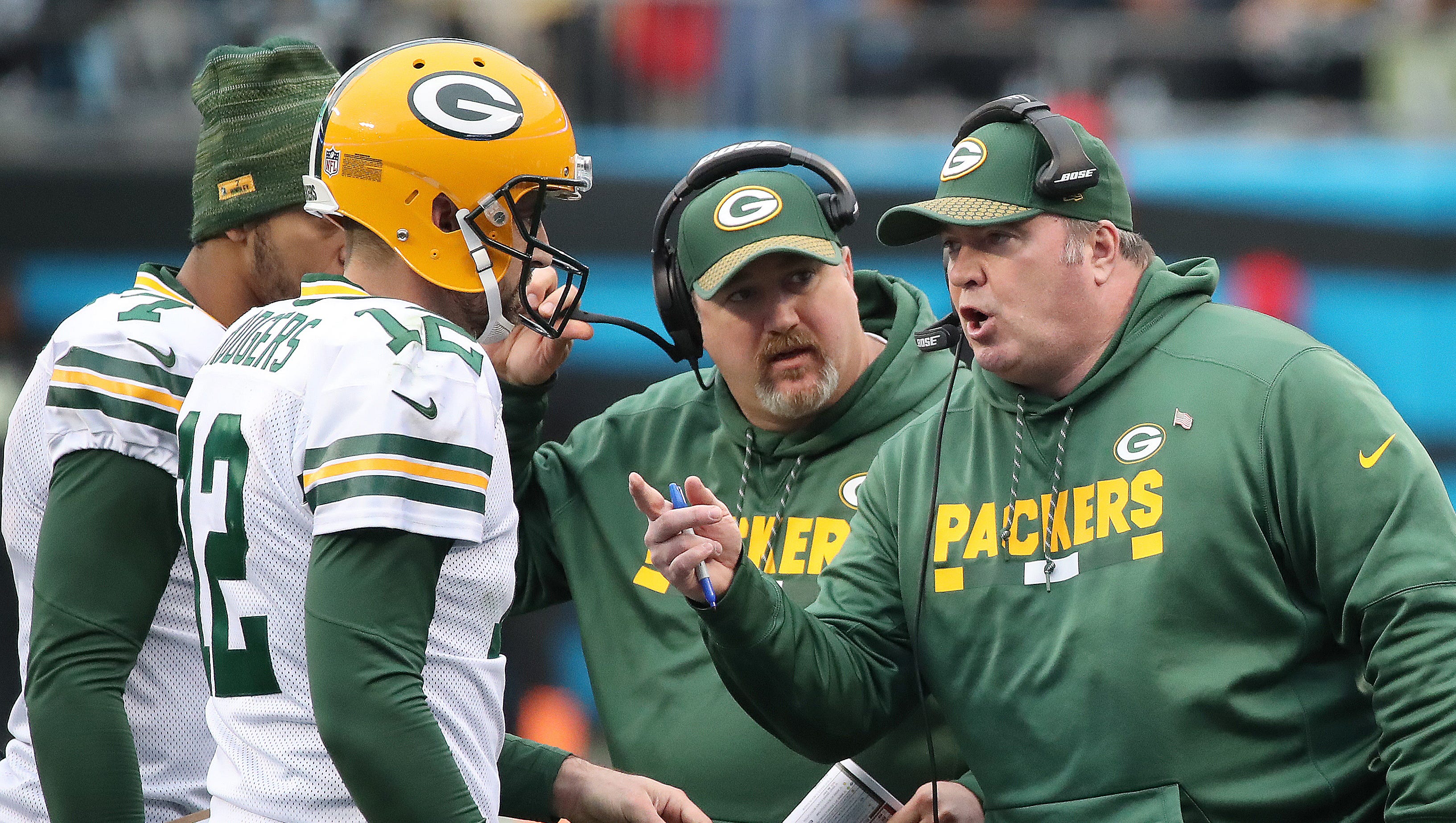 Green Bay Packers quarterback Aaron Rodgers (12) and coach Mike McCarthy talk during a timeout against the Carolina Panthers on Dec. 17, 2017, at Bank of America Stadium in Charlotte, N.C.