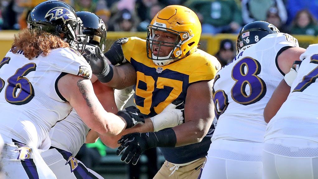 Green Bay Packers nose tackle Kenny Clark (97) rushes against the Baltimore Ravens Sunday, November 19, 2017 at Lambeau Field in Green Bay, Wis.