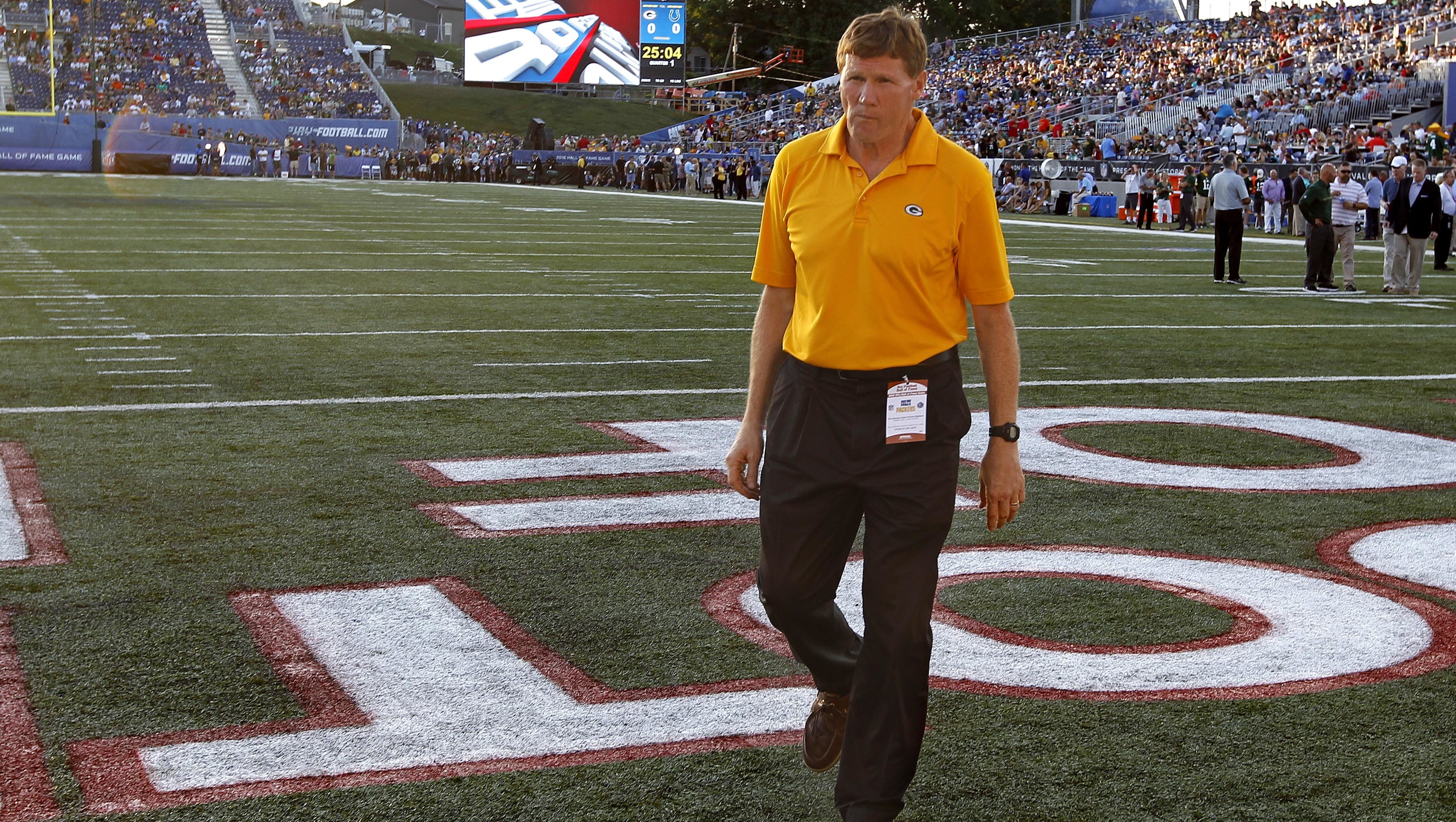 Green Bay Packers President Mark Murphy walks off the field after the NFL preseason game between the Green Bay Packers and Indianapolis Colts was cancelled. Poor field conditions