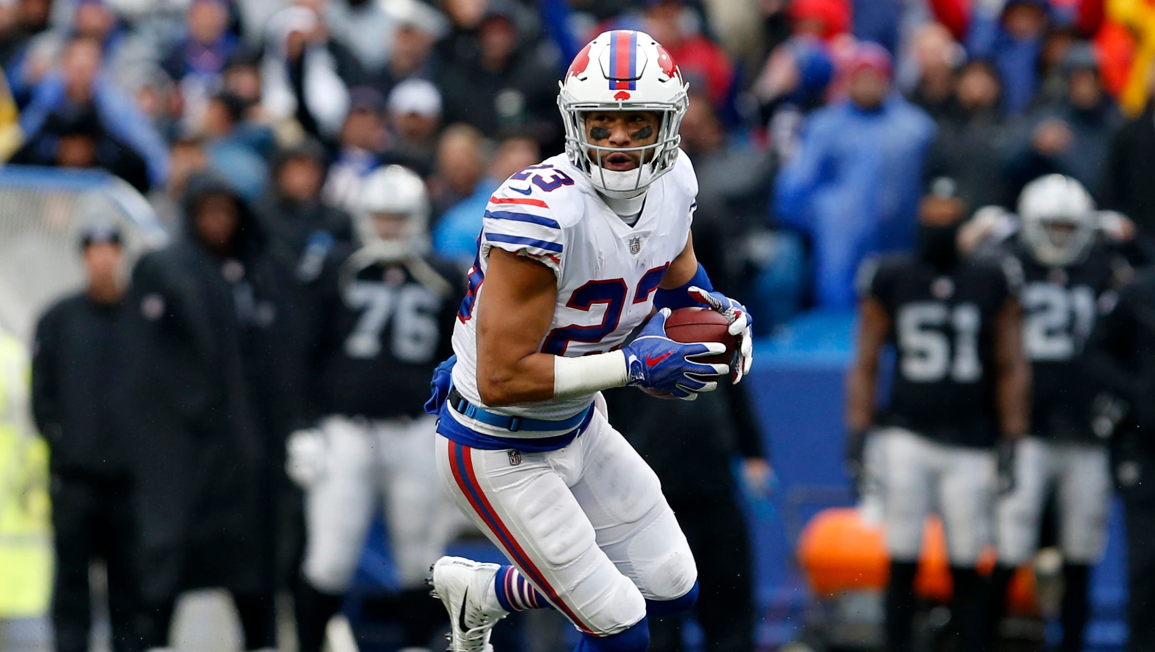 Buffalo Bills safety Micah Hyde (23) runs back a interception during the second half against the Oakland Raiders at New Era Field.