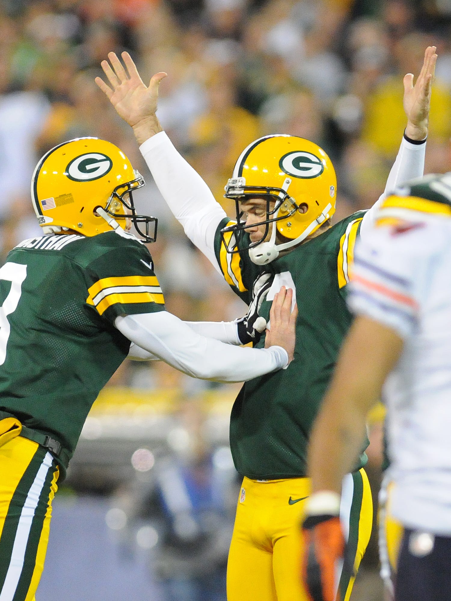 Green Bay Packers kicker Mason Crosby, right, and holder Tim Masthay celebrate a field goal against the Chicago Bears on Sept. 13, 2012, at Lambeau Field.