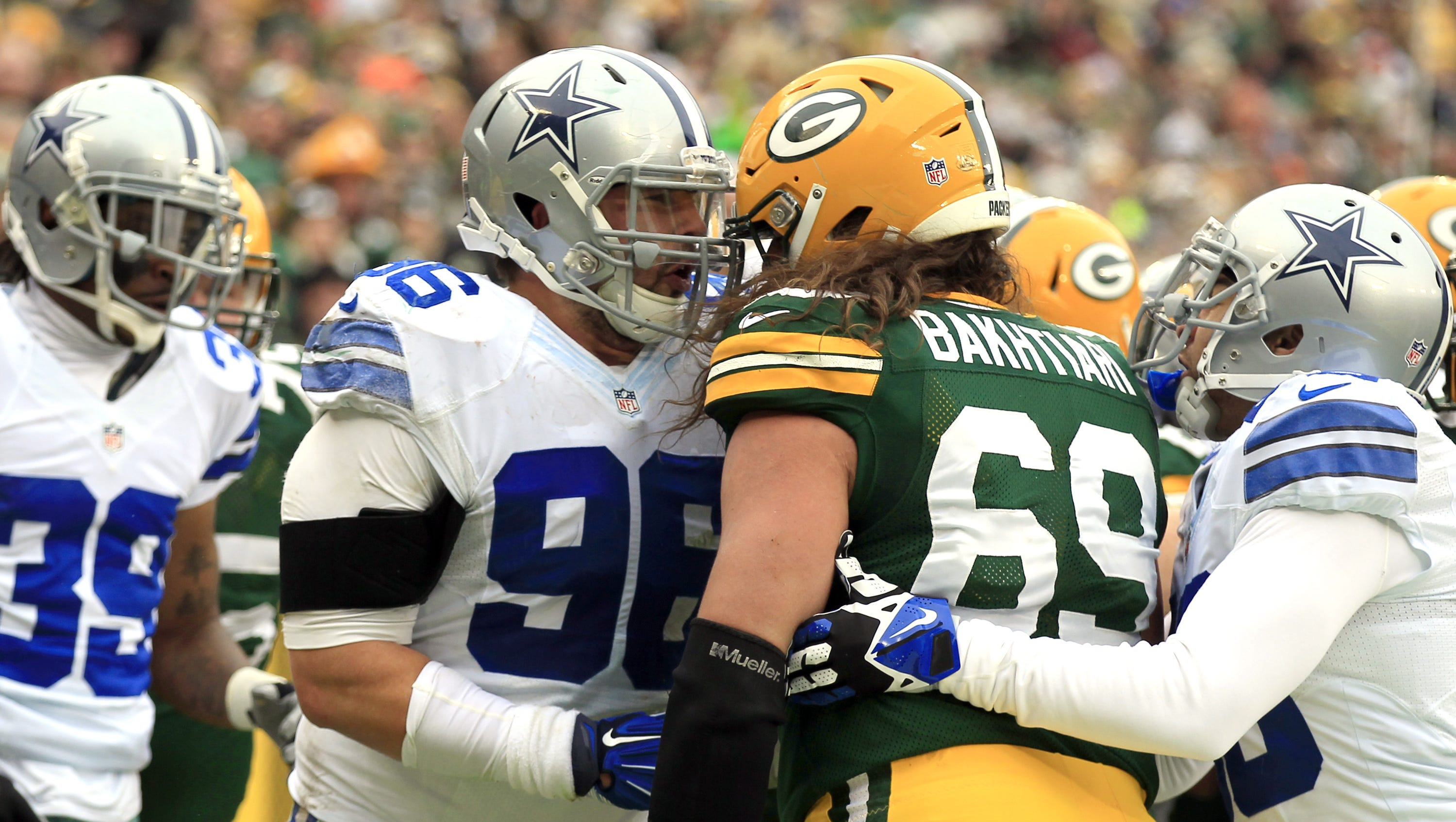Green Bay Packers David Bakhtiari (69) tussles with Nick Hayden (96) of the Dallas Cowboys during an NFC divisional playoff game on Jan. 11, 2015, at Lambeau Field.