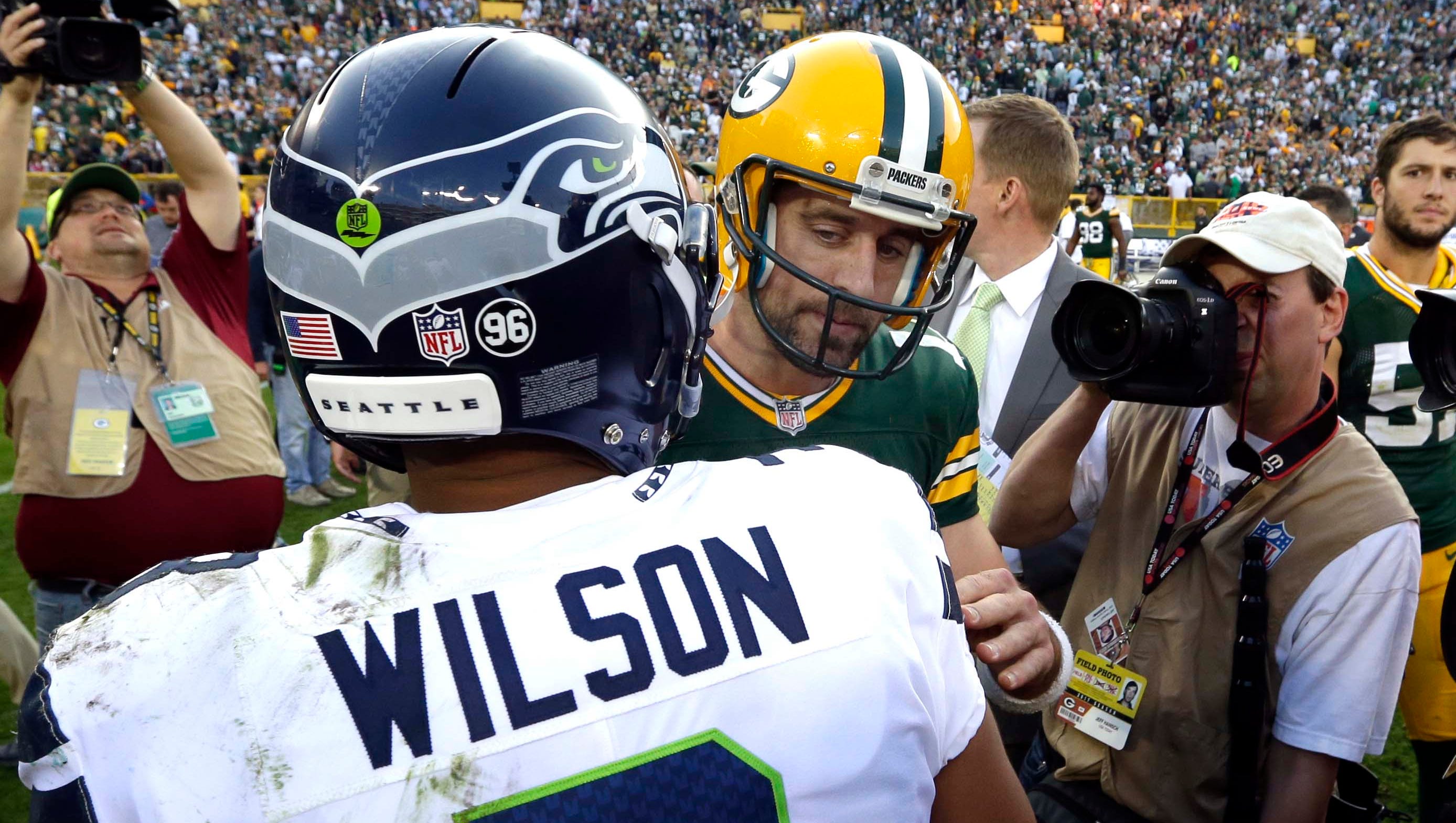 Packers quarterback Aaron Rodgers greets Seahawks quarterback Russell Wilson after the game Sunday.