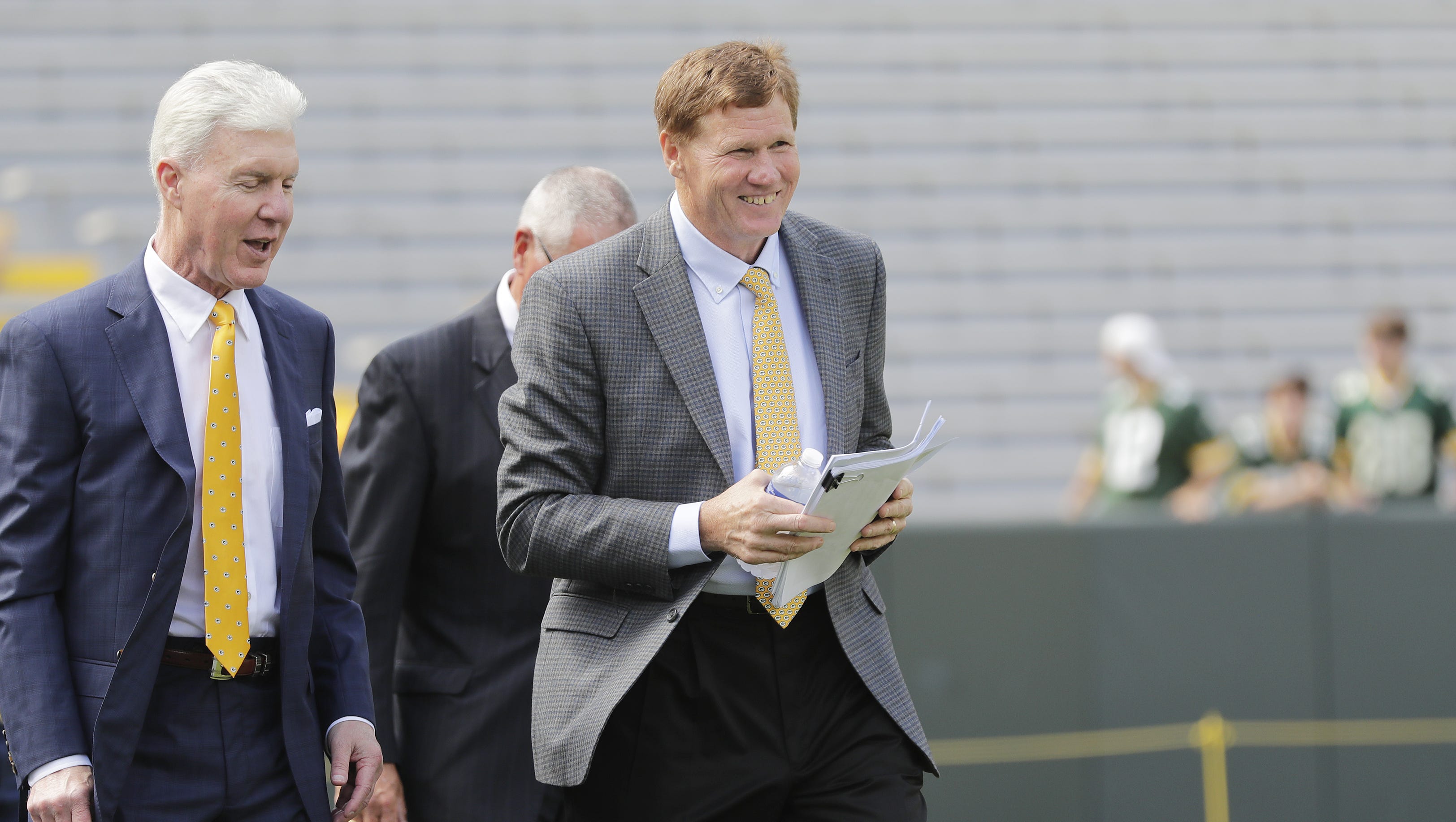 Packers President & CEO Mark Murphy and General Manager Ted Thompson walk onto the field at the annual Green Bay Packers shareholders meeting at Lambeau Field on Monday, July 24, 2017, in Green Bay.
