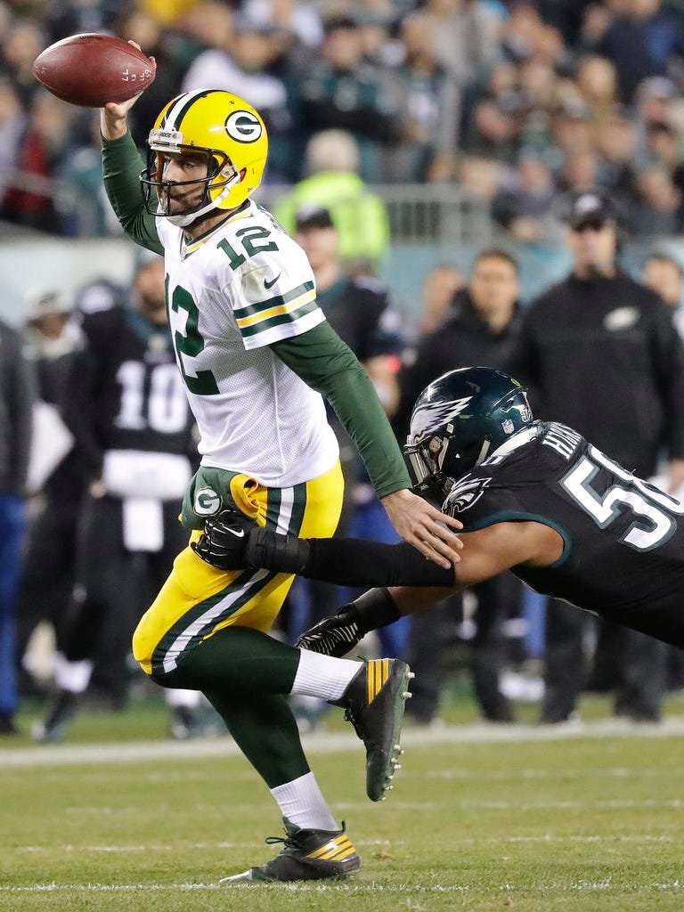 Green Bay Packers quarterback Aaron Rodgers (12) scrambles against the Philadelphia Eagles at Lincoln Financial Field.