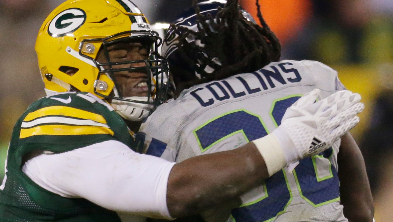 Green Bay Packers nose tackle Kenny Clark (97) Seattle Seahawks running back Alex Collins (36) dead inhistracks for a one yard gain during the fourth quarter of their game Sunday, December 11, 2016 at Lambeau Field in Green Bay, Wis. The Green Bay Packers beat the Seattle Seahawks 38-10.
