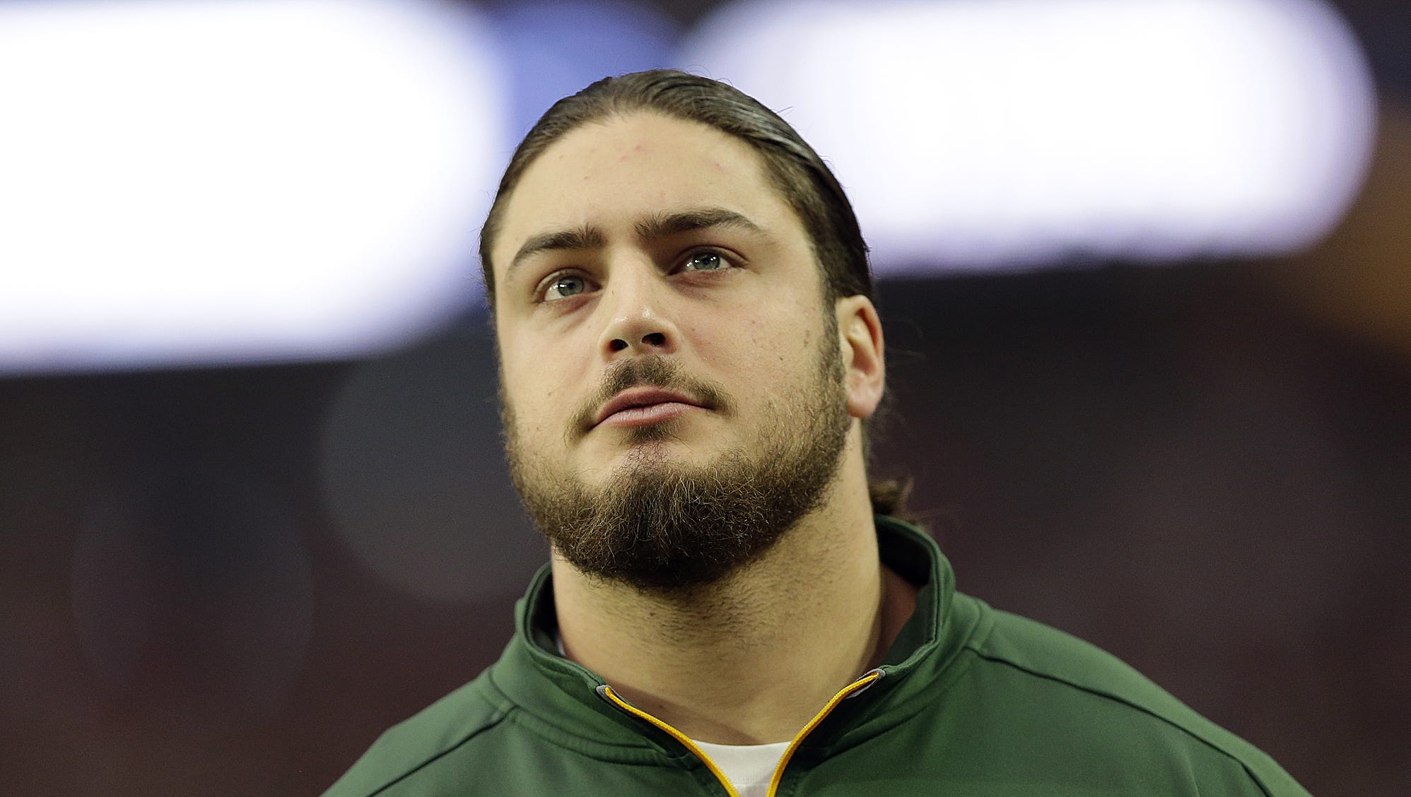 Green Bay Packers tackle David Bakhtiari looks on from the sidelines during a game against the Arizona Cardinals on Dec. 27, 2015, at University of Phoenix Stadium in Glendale, Ariz.