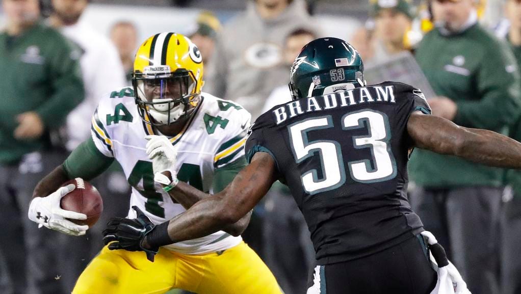 Green Bay Packers running back James Starks (44) tried to cut around defender outside linebacker Nigel Bradham (53) against the Philadelphia Eagles at Lincoln Financial Field.