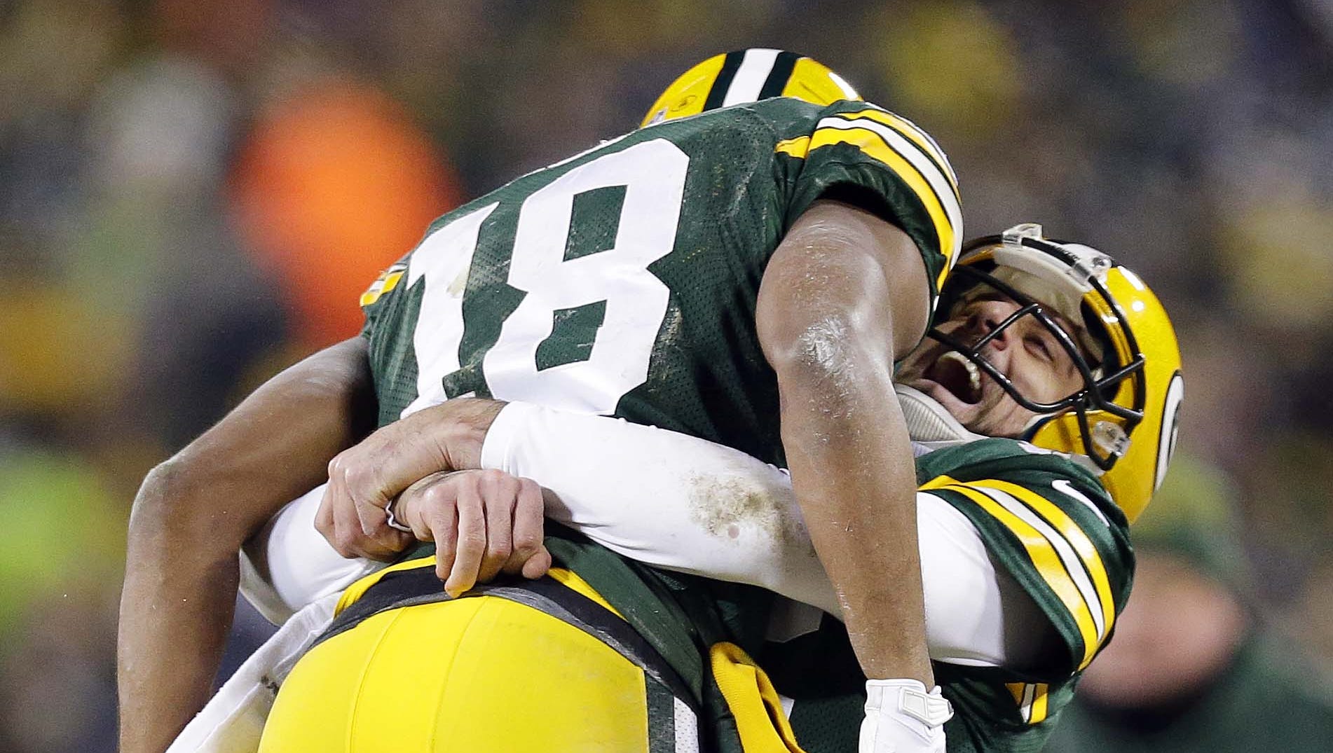 Green Bay Packers quarterback Aaron Rodgers and receiver Randall Cobb celebrate their 42-yard Hail Mary touchdown at the end of the second quarter on Jan. 8, 2016, at Lambeau Field.