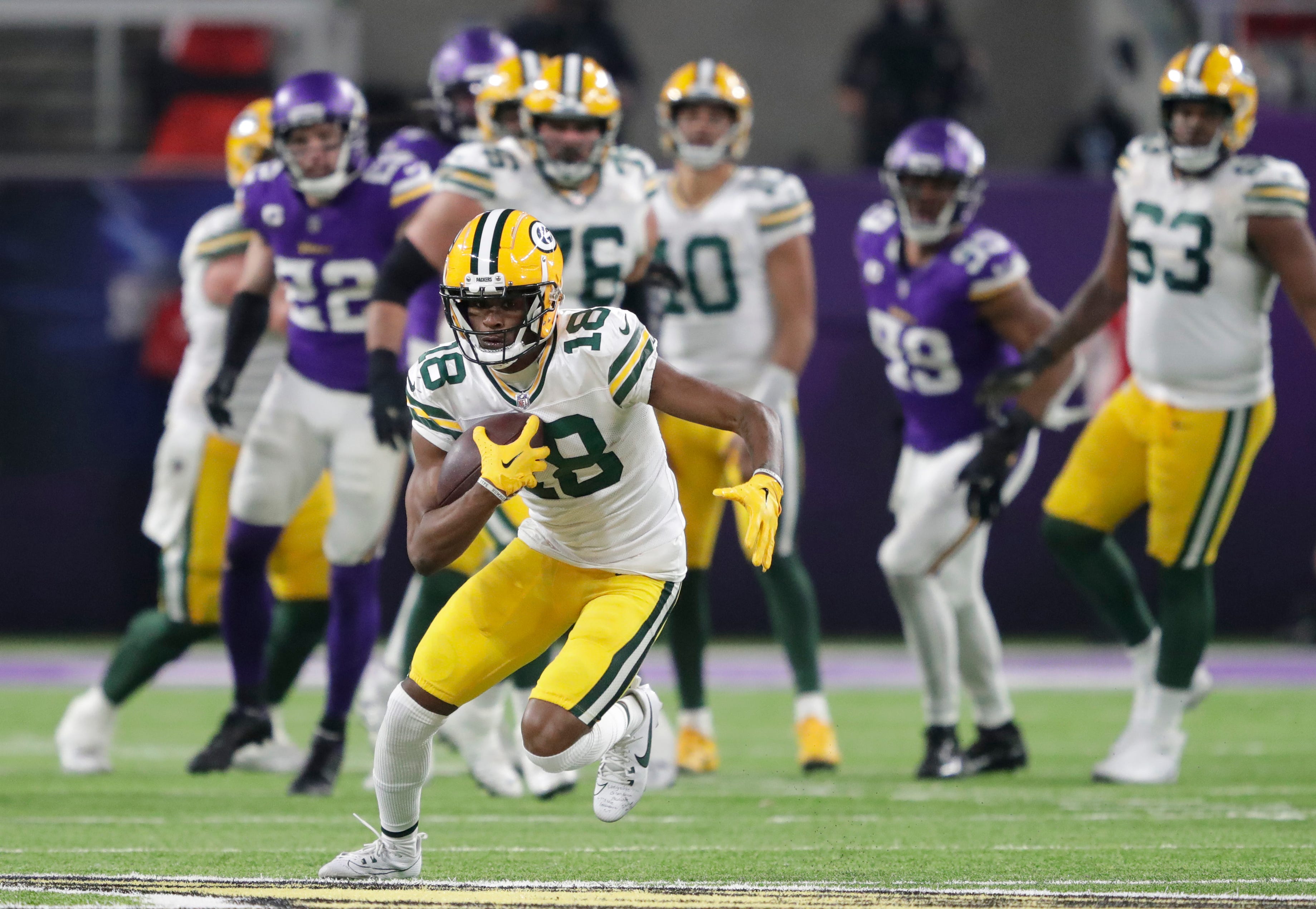 Green Bay Packers wide receiver Malik Heath (18) breaks away for a long reception against the Minnesota Vikings during their football game Sunday, December 31, 2023, at U.S. Bank Stadium in Minneapolis, Minnesota.