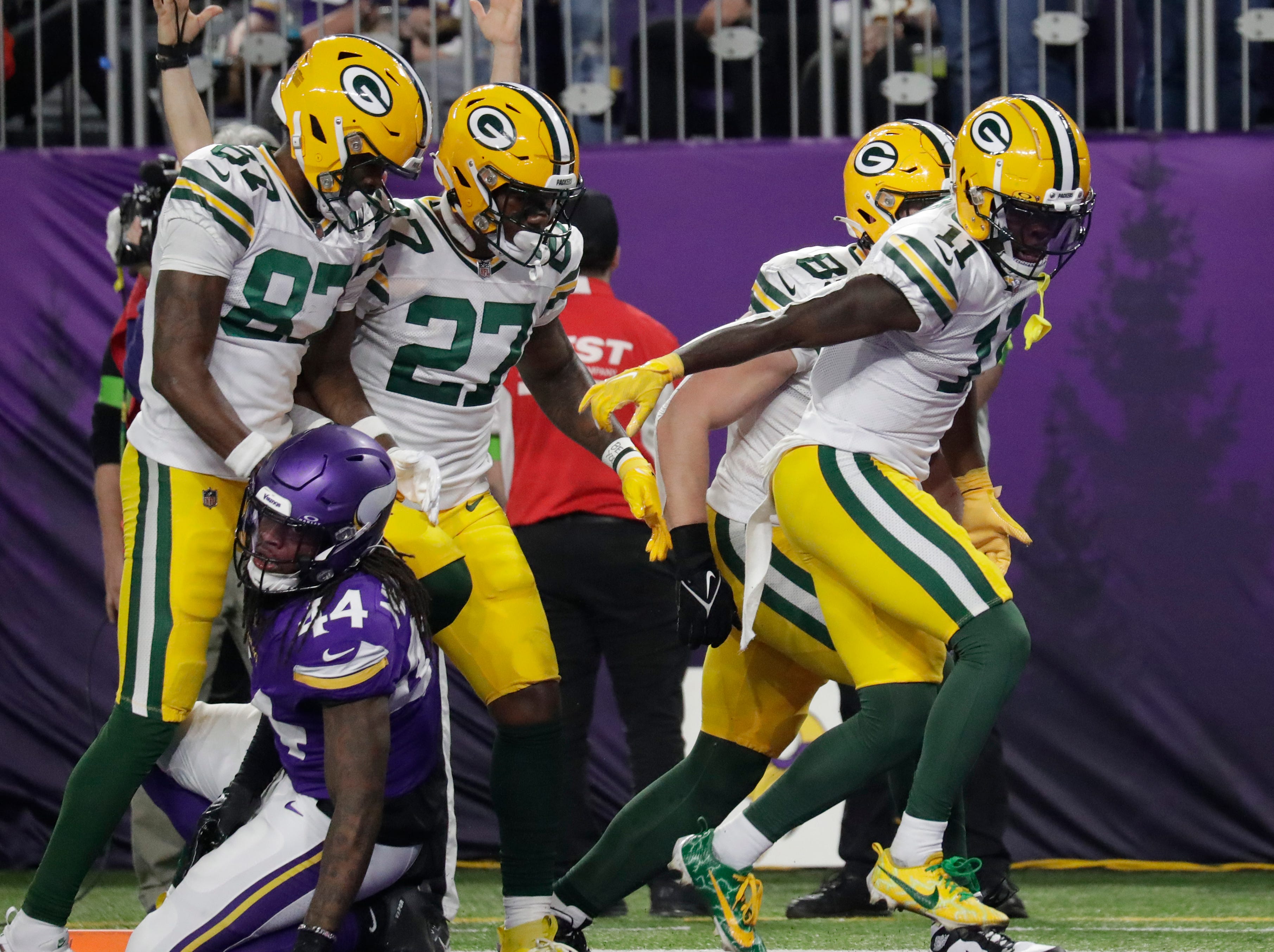 Green Bay Packers wide receiver Jayden Reed (11) celebrates his second quarter touchdown against the Minnesota Vikings during their football game Sunday, Dec. 31, 2023, at U.S. Bank Stadium in Minneapolis, Minnesota.