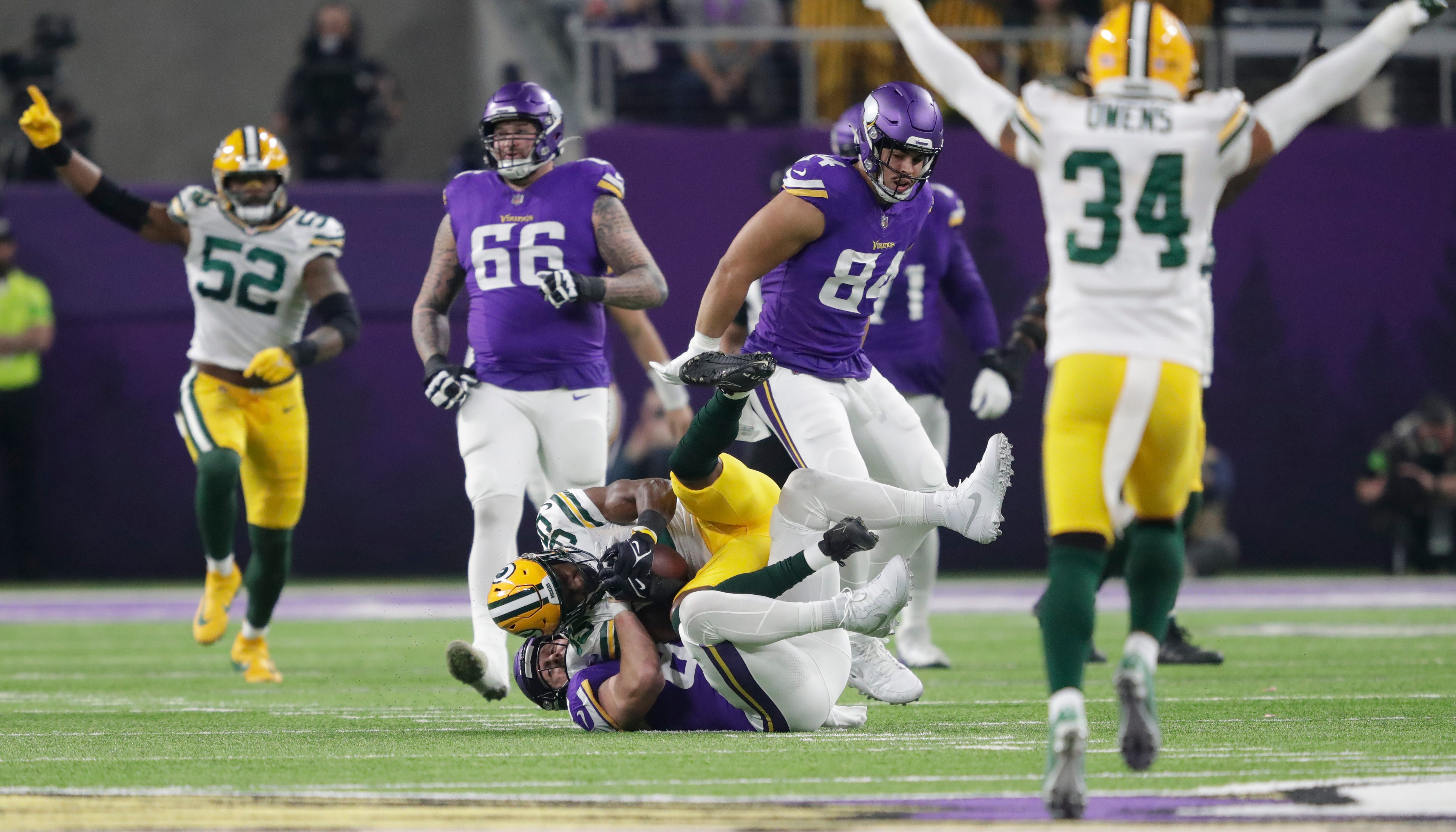 Green Bay Packers cornerback Corey Ballentine (35) intercepts a pass intended for Minnesota Vikings tight end Johnny Mundt (86) during their football game Sunday, Dec. 31, 2023, at U.S. Bank Stadium in Minneapolis, Minnesota.