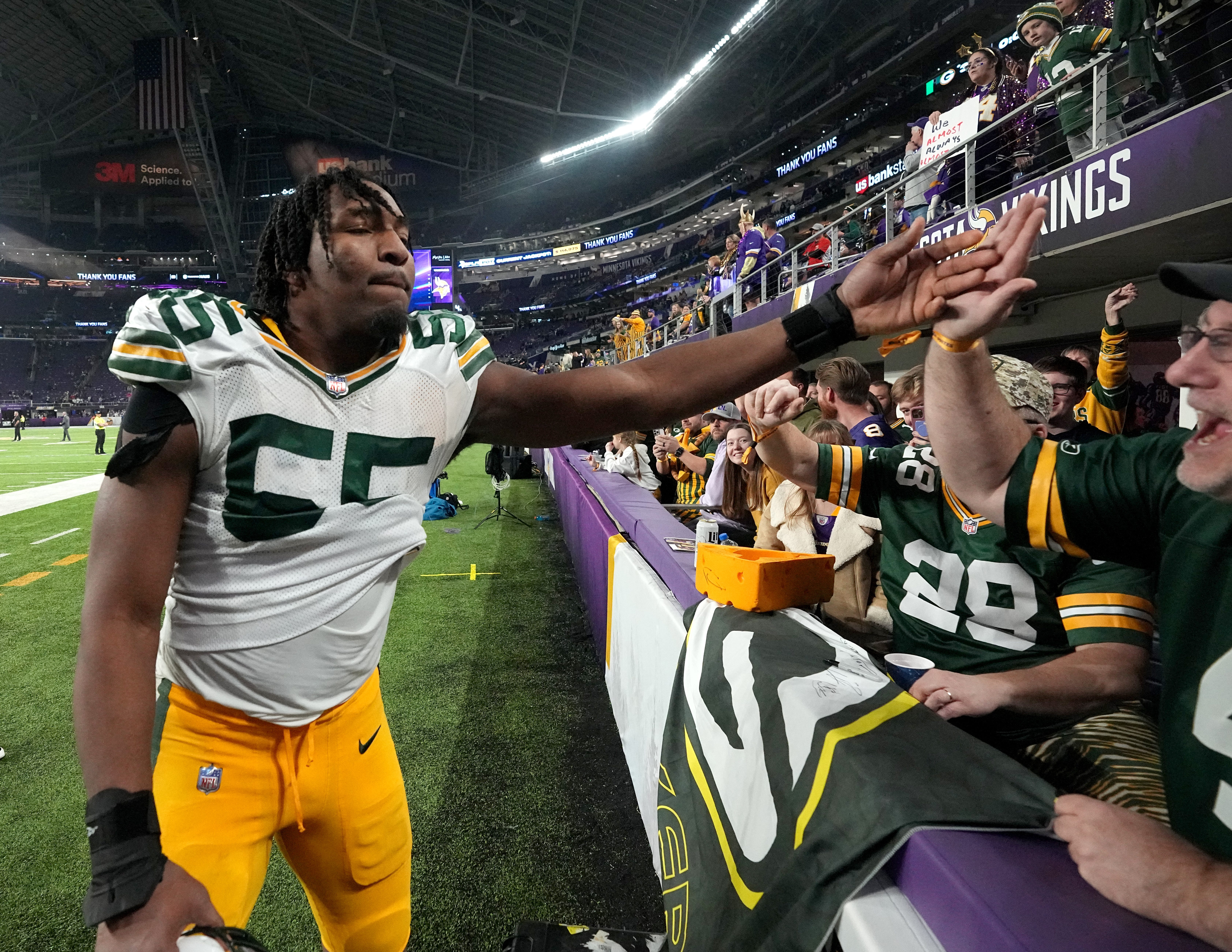 Green Bay Packers linebacker Kingsley Enagbare (55) celebrates his team’s win after their game Sunday, December 31, 2023 at U.S. Bank Stadium in Minneapolis, Minnesota. The Green Bay Packers beat the Minnesota Vikings 33-10.
