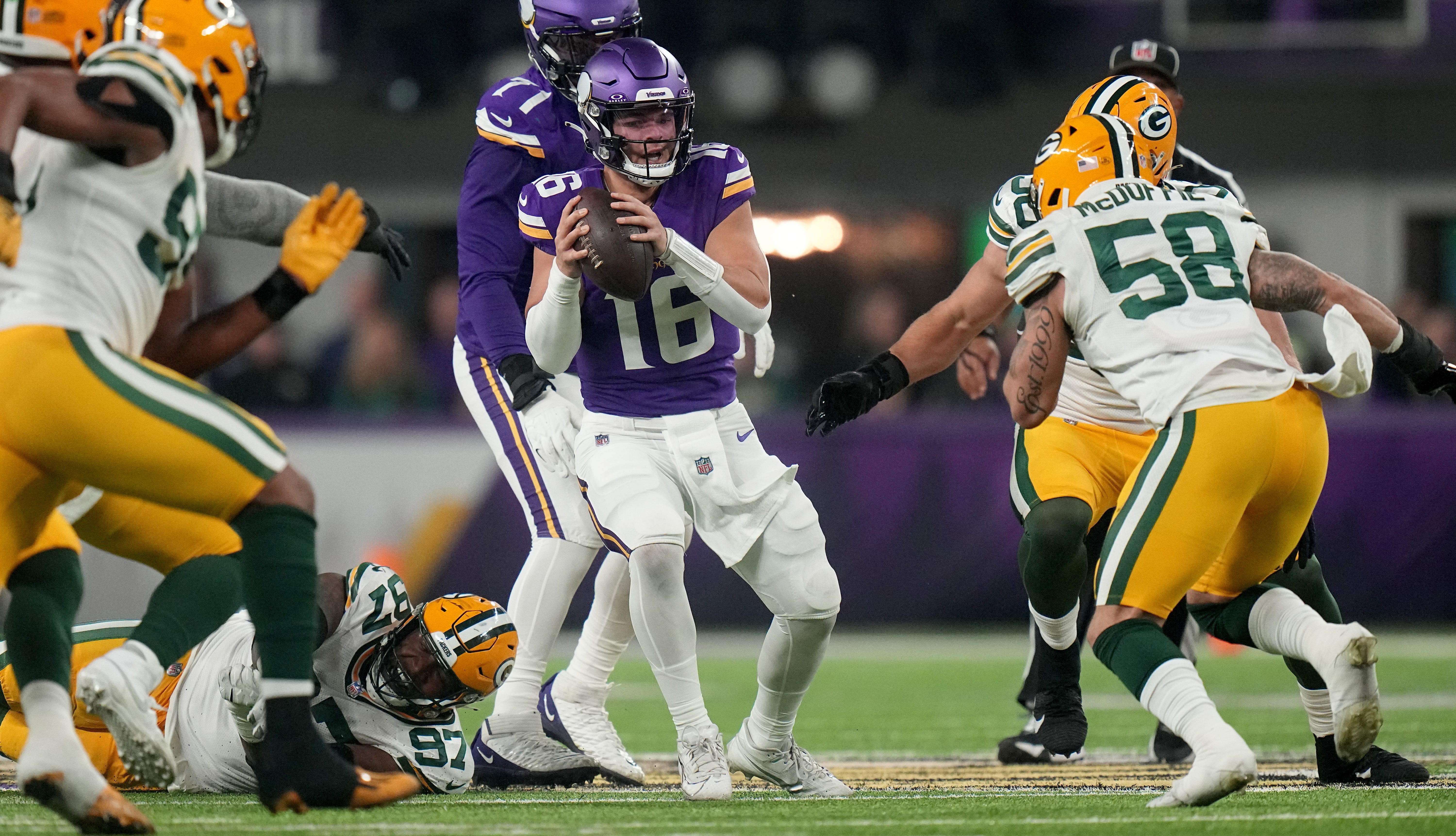 Minnesota Vikings quarterback Jaren Hall (16) is pressured by the Green Bay Packers defense during the second quarter of their game Sunday, December 31, 2023 at U.S. Bank Stadium in Minneapolis, Minnesota.