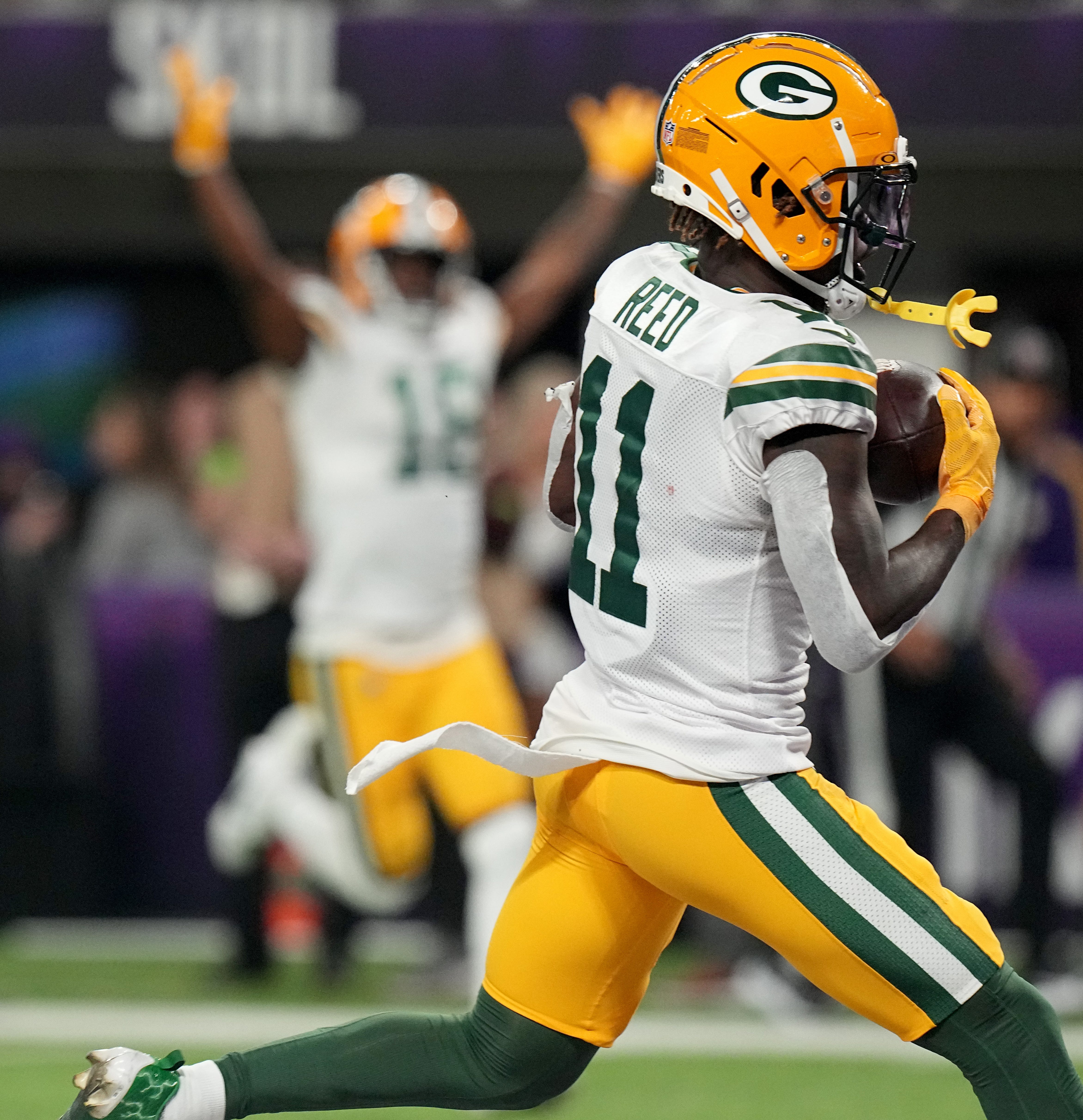 Green Bay Packers wide receiver Jayden Reed (11) catches a touchdown pass during the first quarter of their game Sunday, December 31, 2023 at U.S. Bank Stadium in Minneapolis, Minnesota. The Green Bay Packers beat the Minnesota Vikings 33-10.