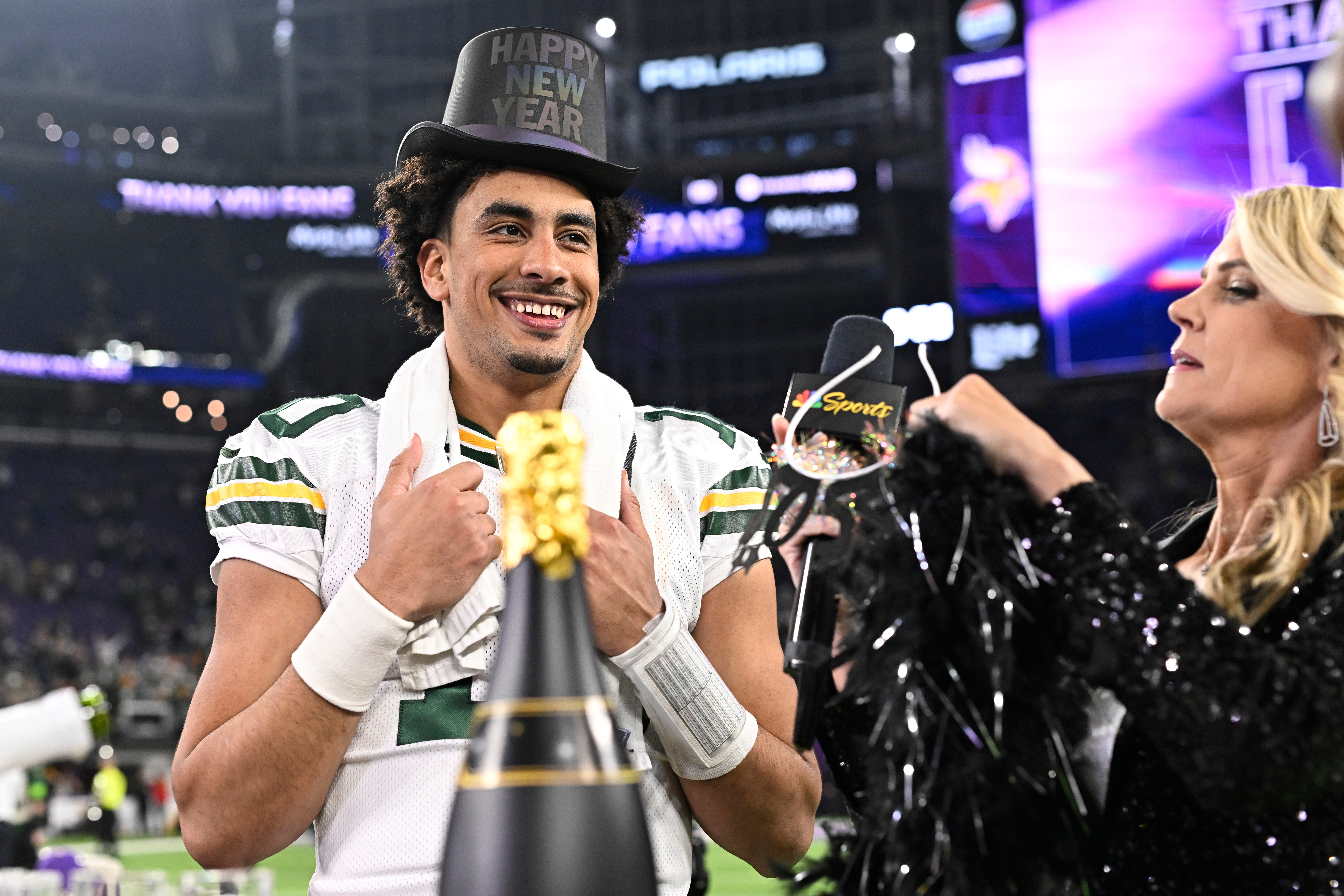 Jordan Love #10 of the Green Bay Packers celebrates on New Year's Eve during his post-game interview after a 33-10 victory against the Minnesota Vikings at U.S. Bank Stadium on December 31, 2023 in Minneapolis, Minnesota.