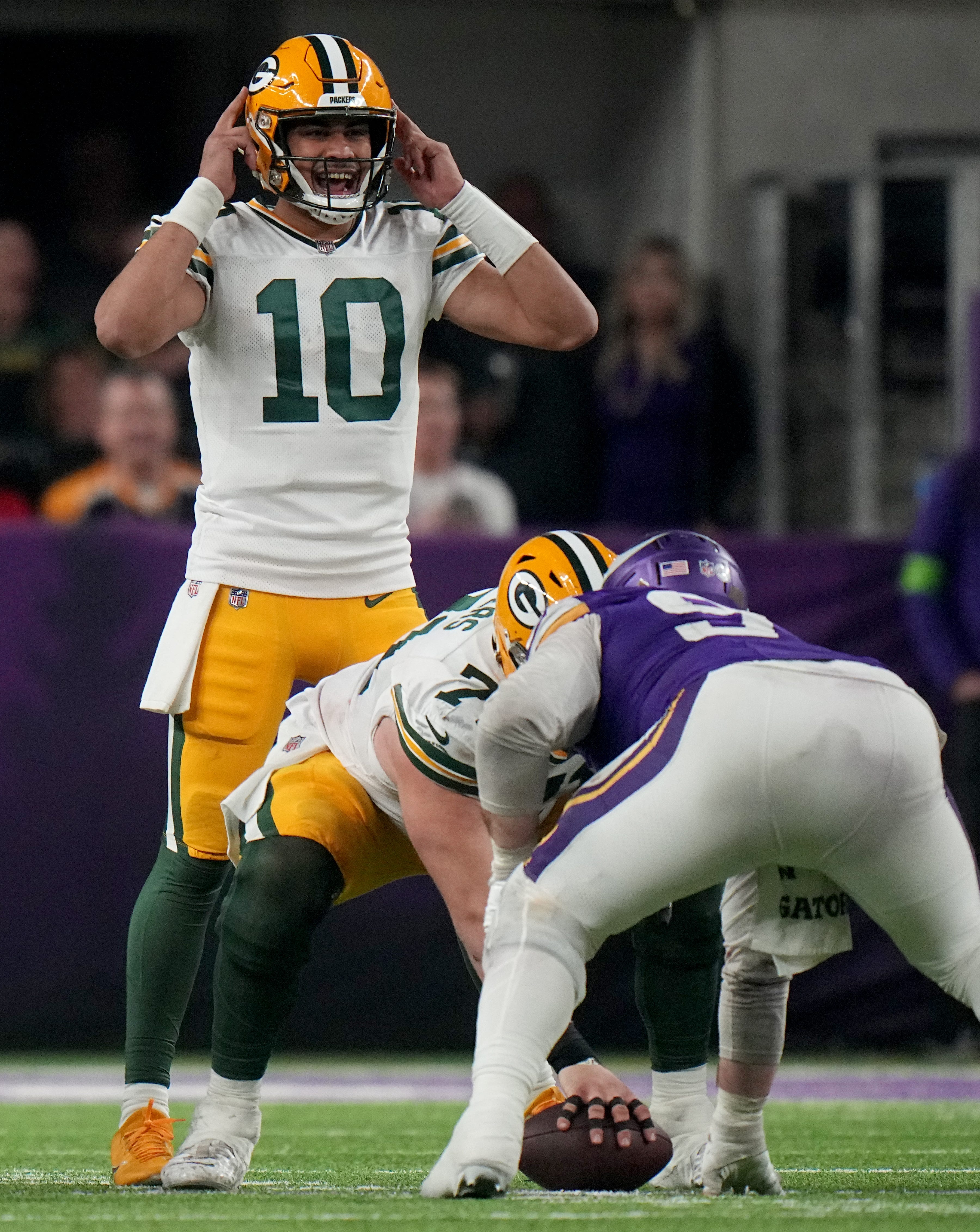Green Bay Packers quarterback Jordan Love (10) makes an adjustment at the line during the fourth quarter of their game Sunday, December 31, 2023 at U.S. Bank Stadium in Minneapolis, Minnesota. The Green Bay Packers beat the Minnesota Vikings 33-10.