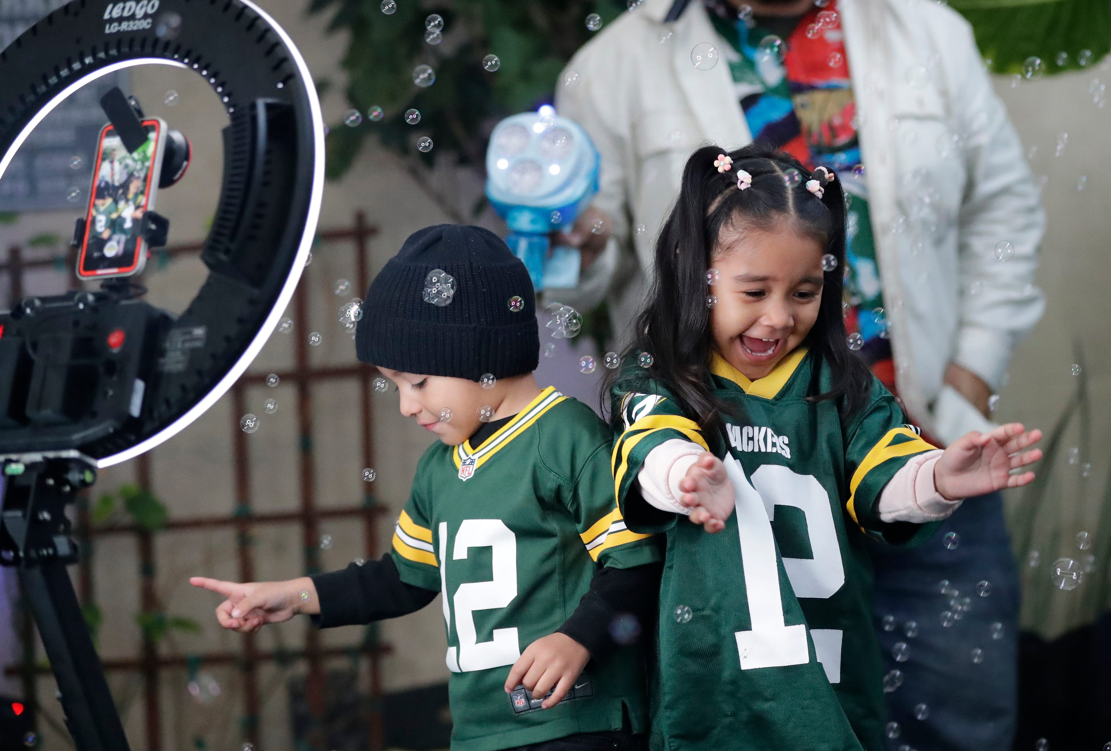 Green Bay Packers fans Ellijah King Guifarro, 3, left, and his sister Ariella Guifarro, 3, of Richmond, California dance together during a 360-degree video during the Packers Everywhere pep rally Friday, January 19, 2024, at The Patio in Palo Alto, California.